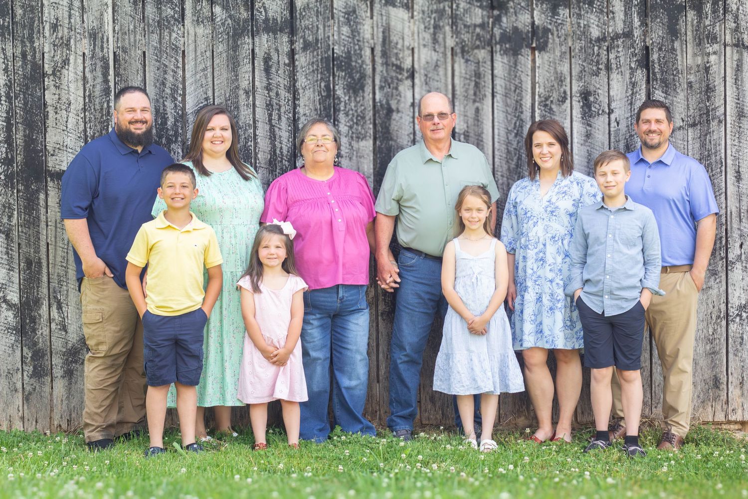Large extended family posing together outdoors for a group portrait