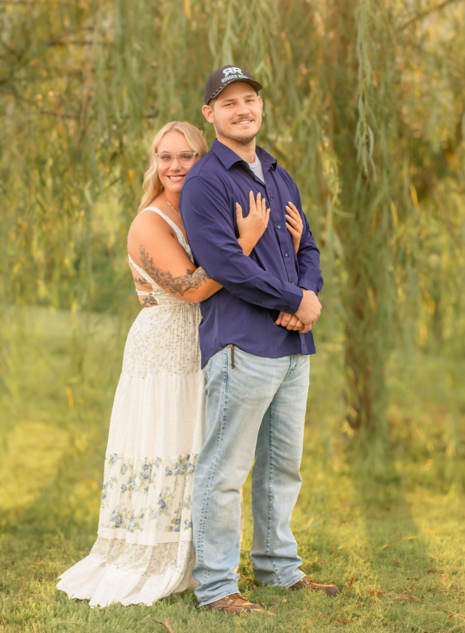 Couple embracing during an outdoor engagement session