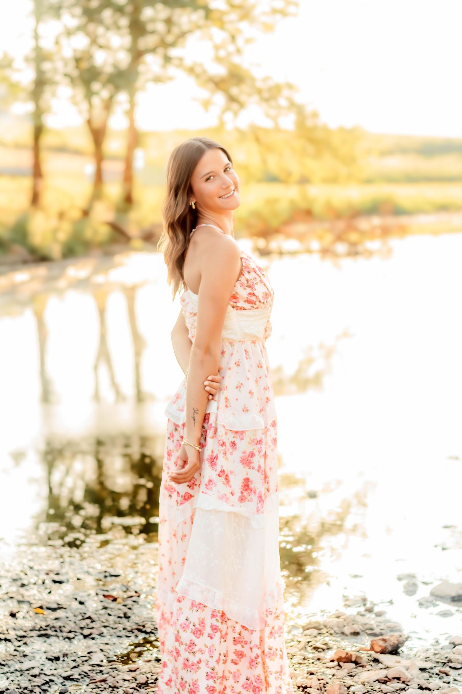 High school senior girl posing outdoors for a senior portrait session