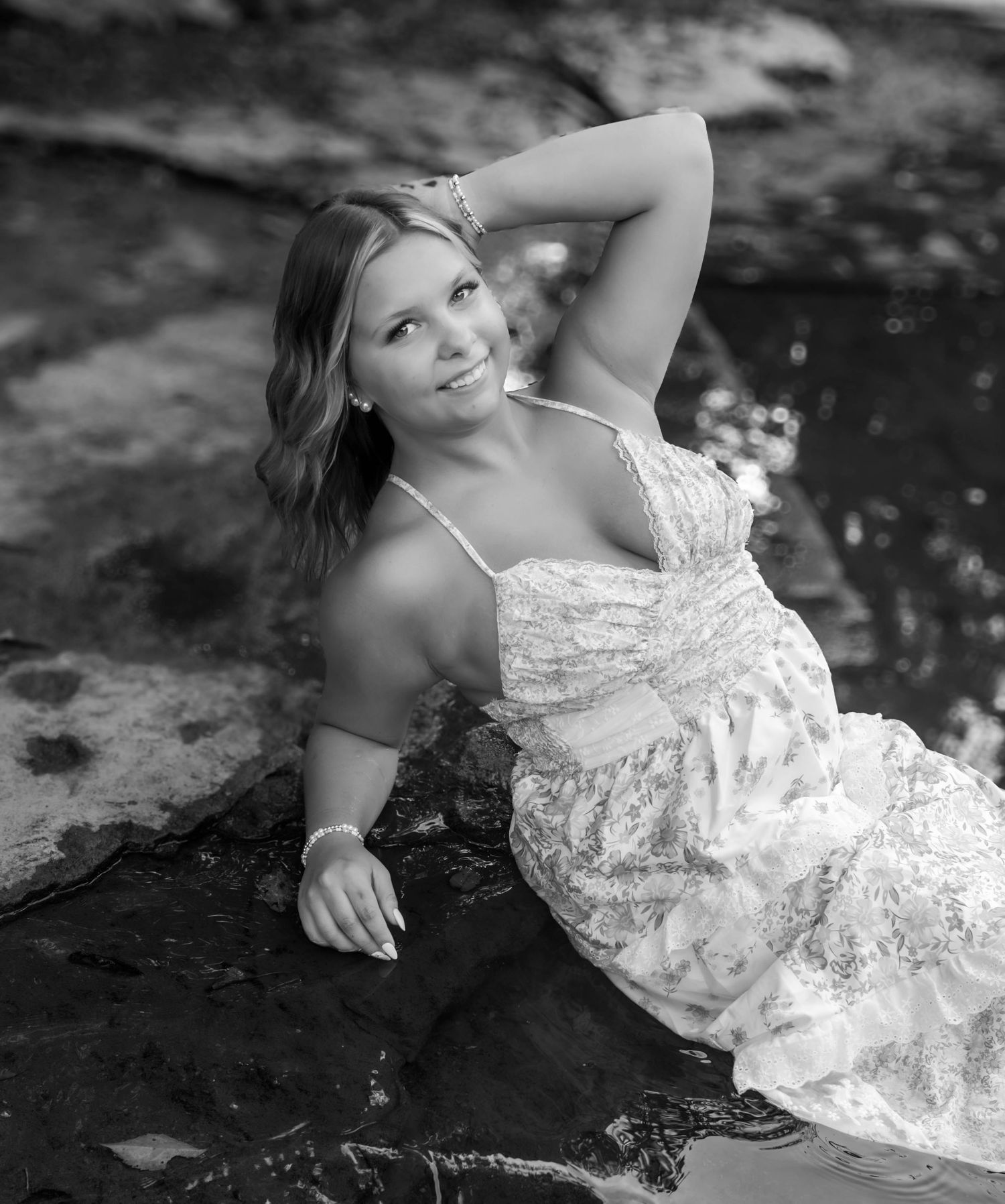 High school senior girl posing outdoors for a senior portrait session