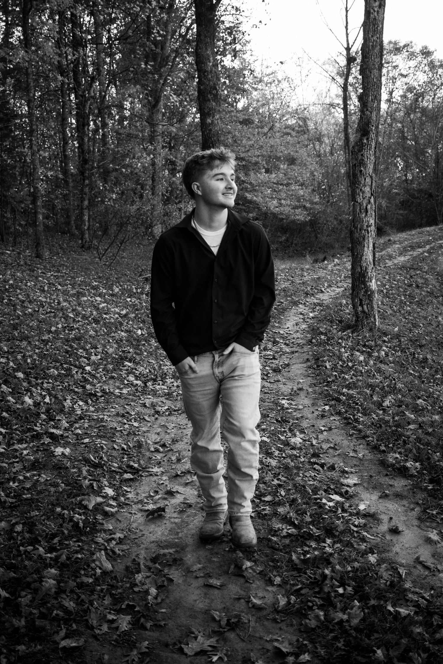High school senior boy posing outdoors for a senior portrait session
