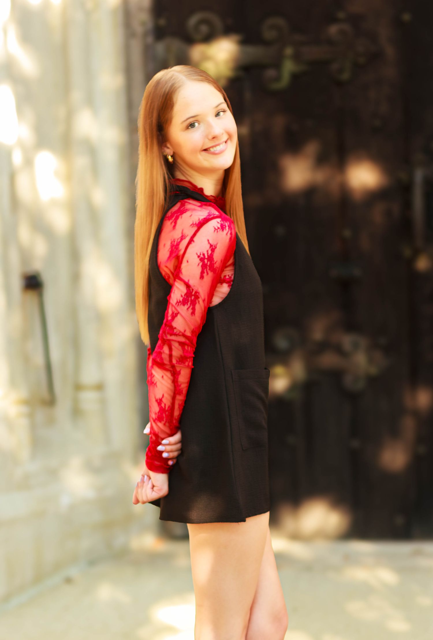 High school senior girl posing outdoors for a senior portrait session