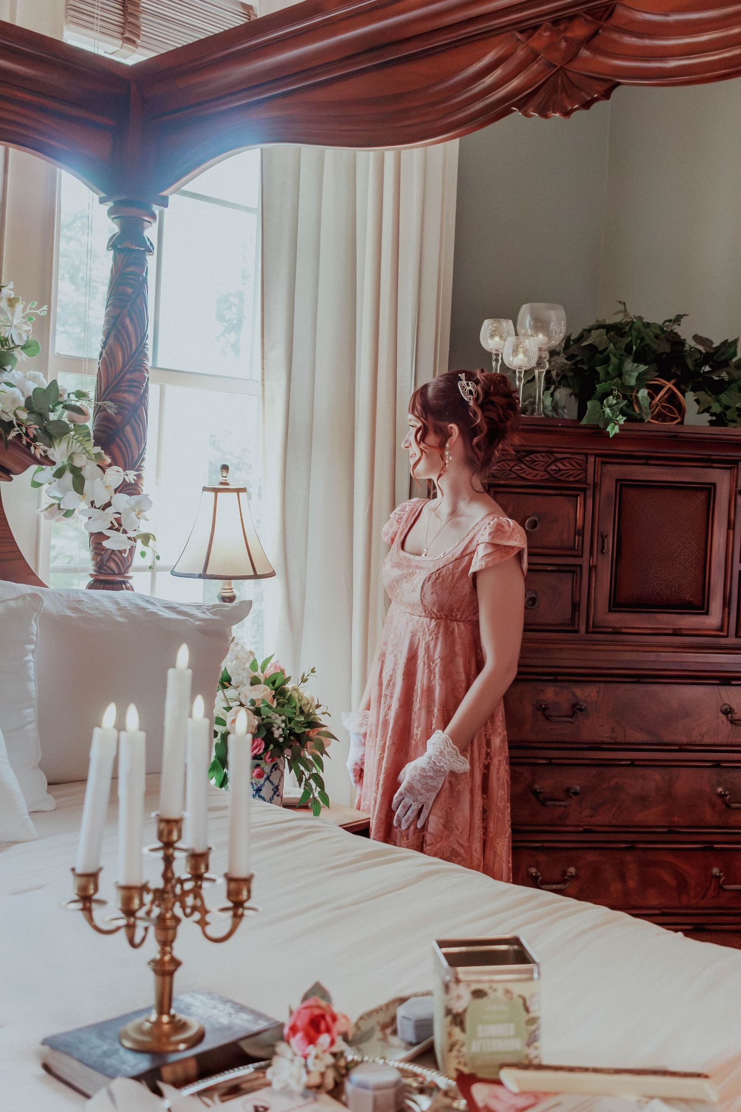 Bride standing beside elegant ceremony décor inside the wedding venue.