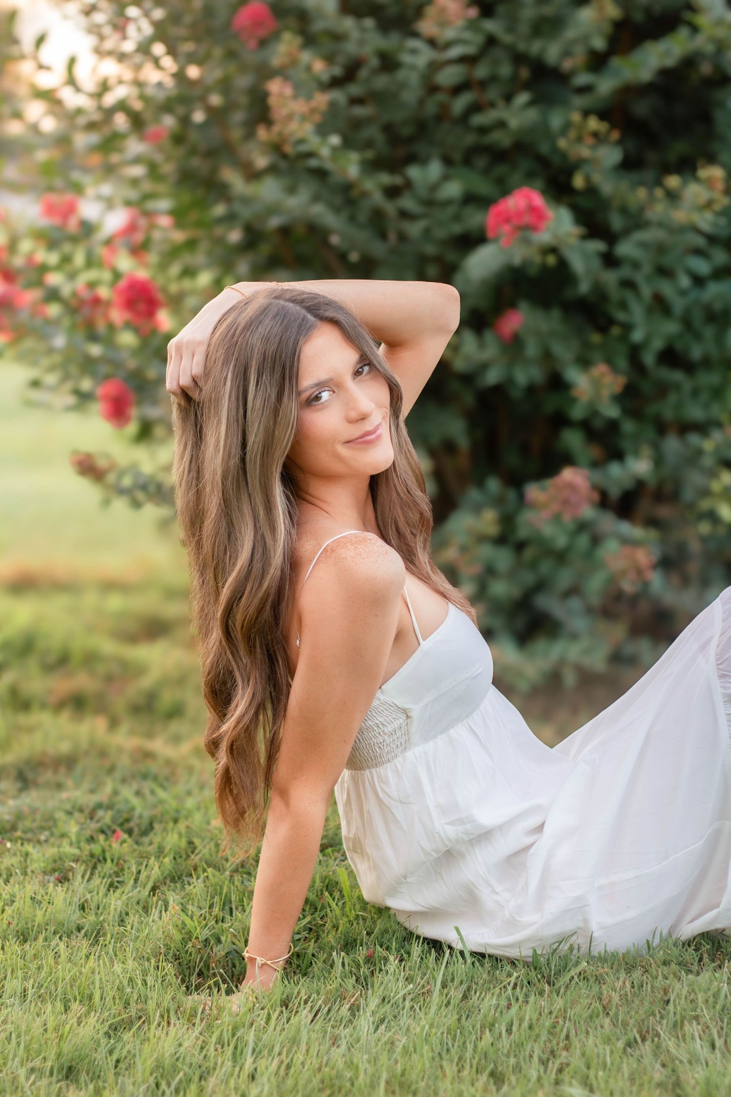 High school senior girl posing outdoors for a senior portrait session