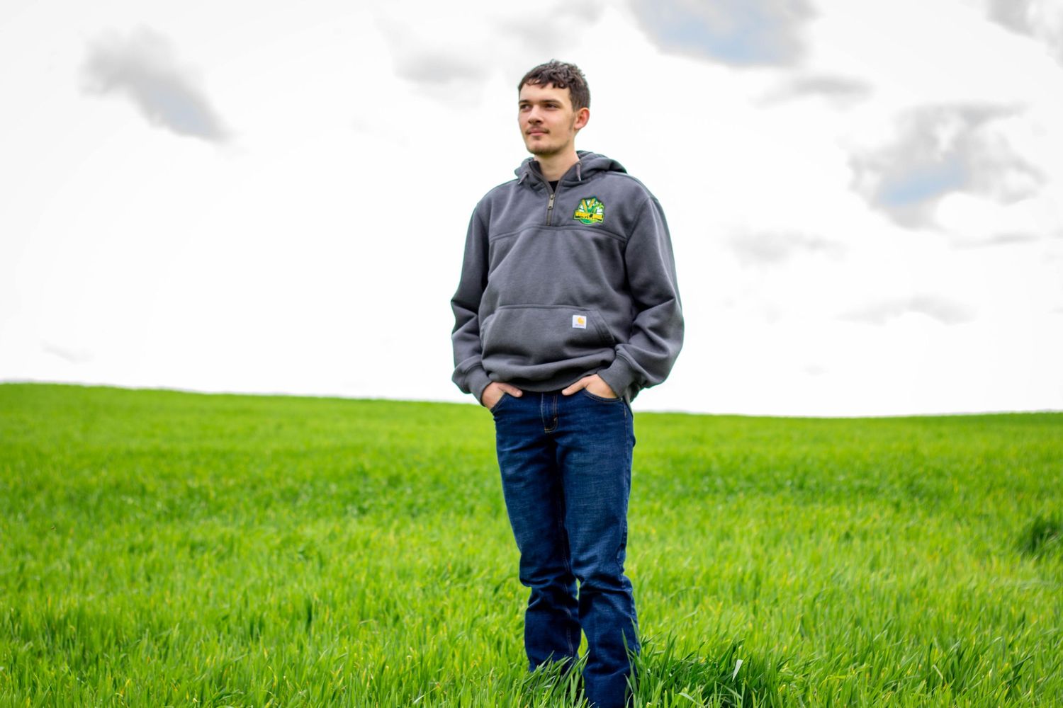 High school senior boy posing outdoors for a senior portrait session