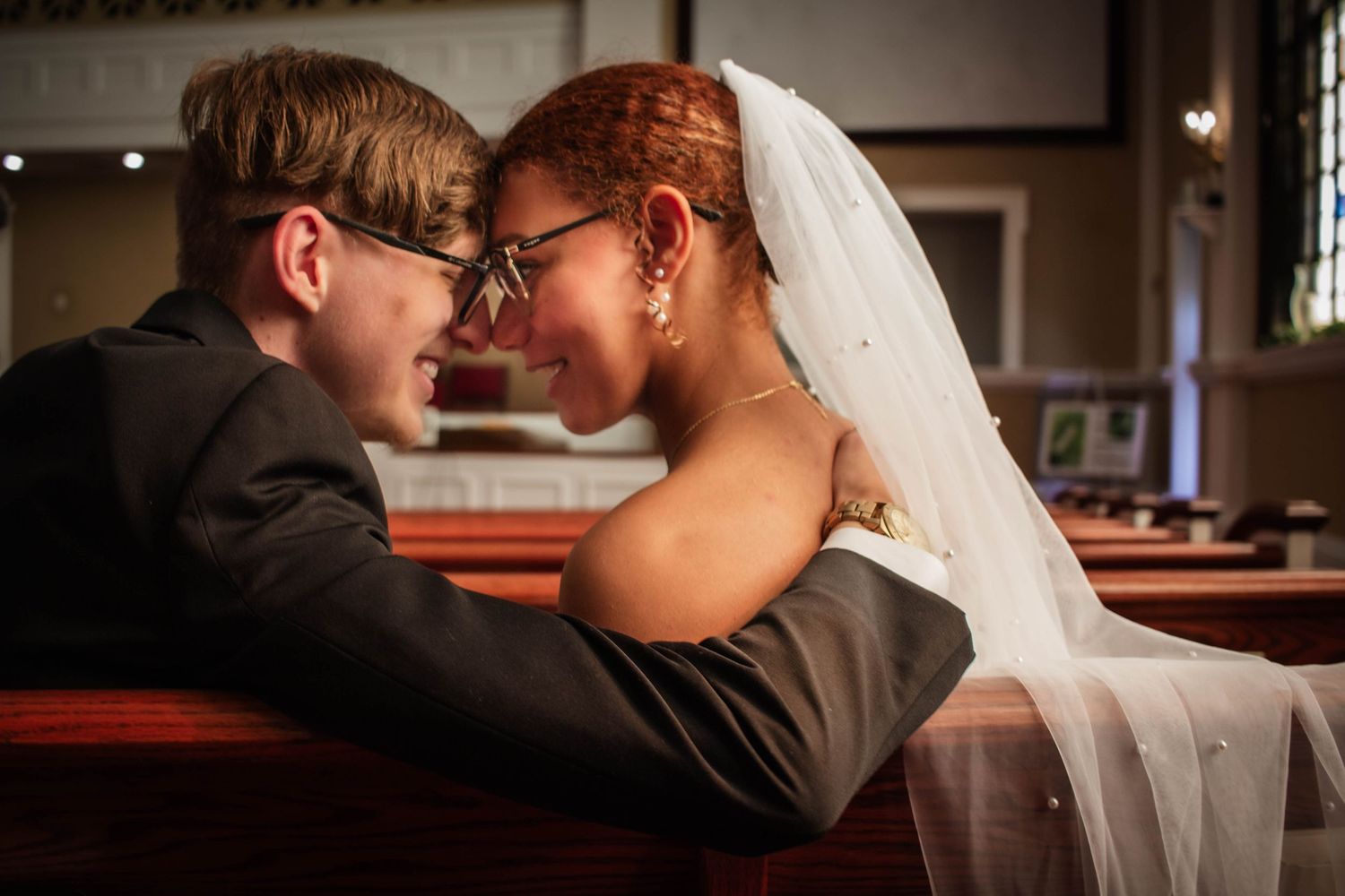Newlywed couple embracing during their wedding day.