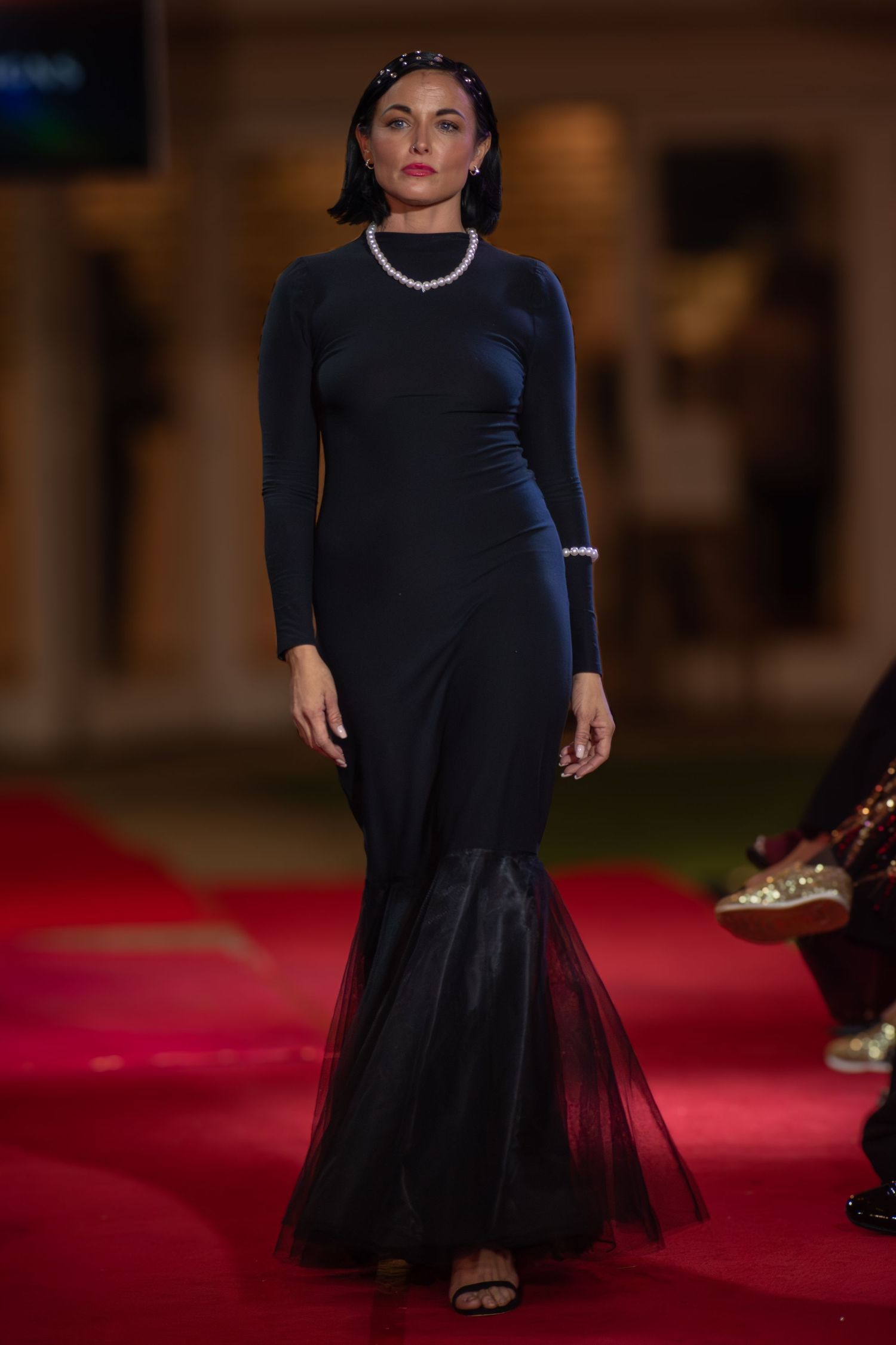 Designer showcasing a new collection at a Brisbane runway show.