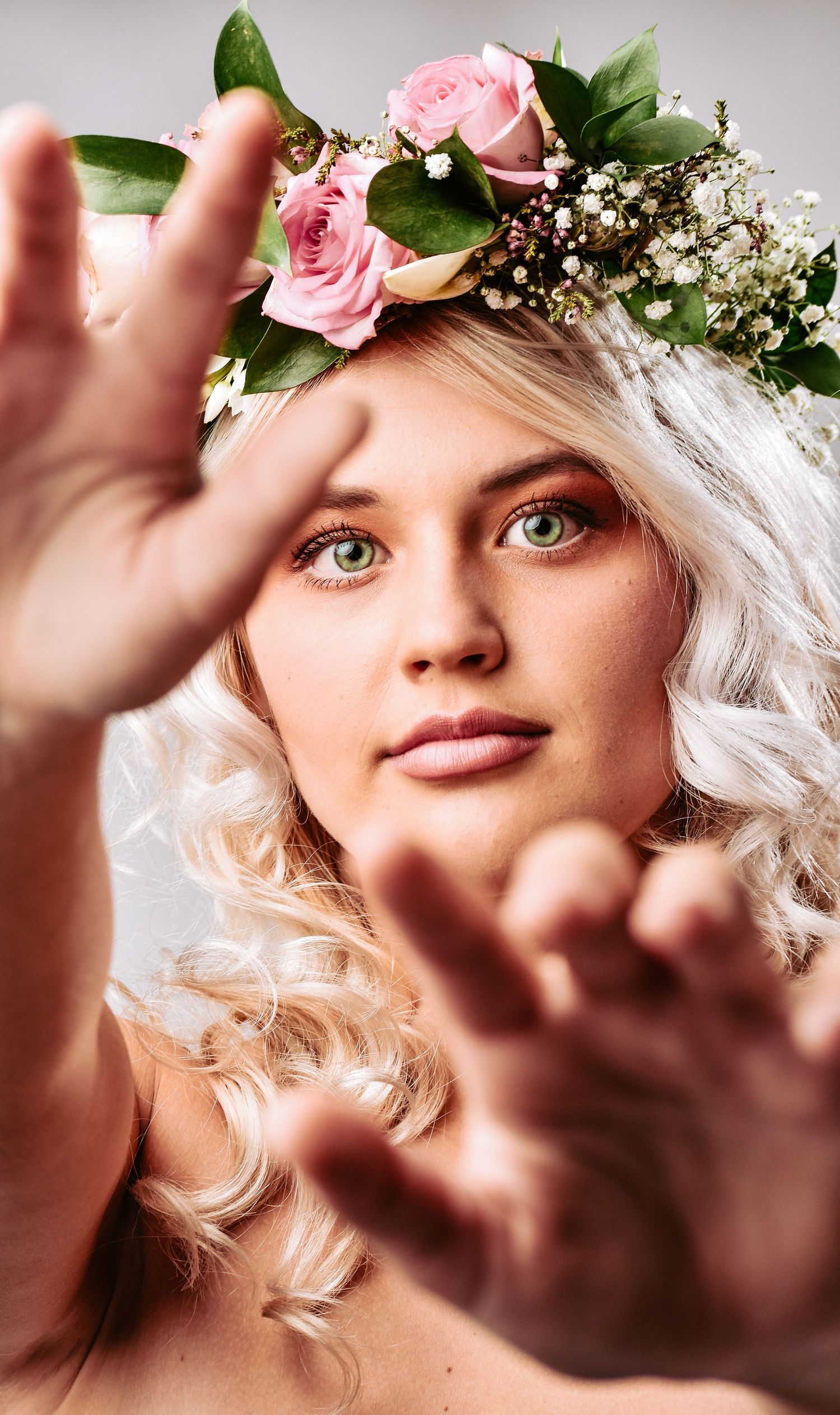 Creative headshot with a beautiful flower crown in a studio in South Africa.