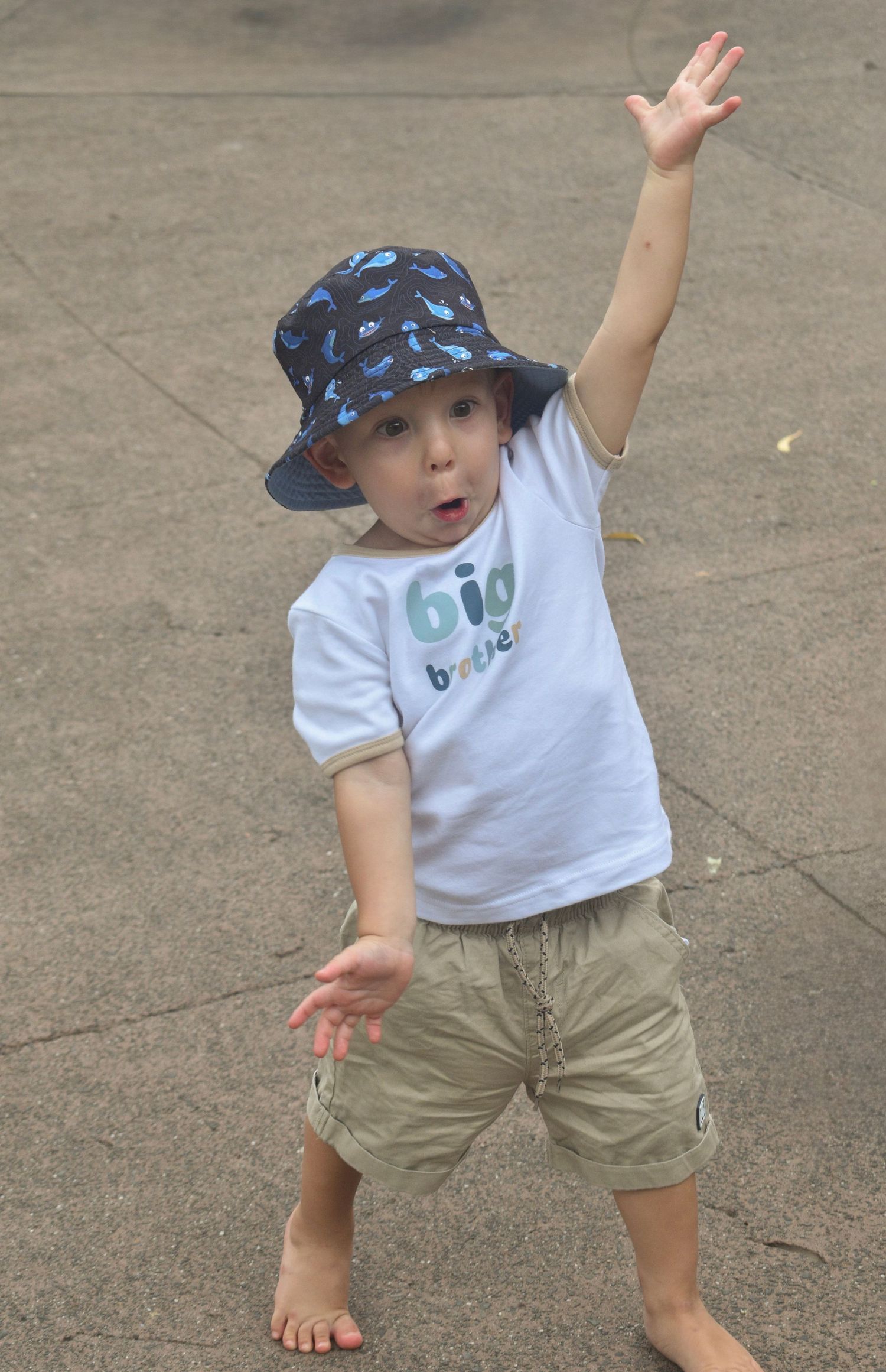 Candid picture of a boy seeing a crocodile at the Brisbane Zoo.