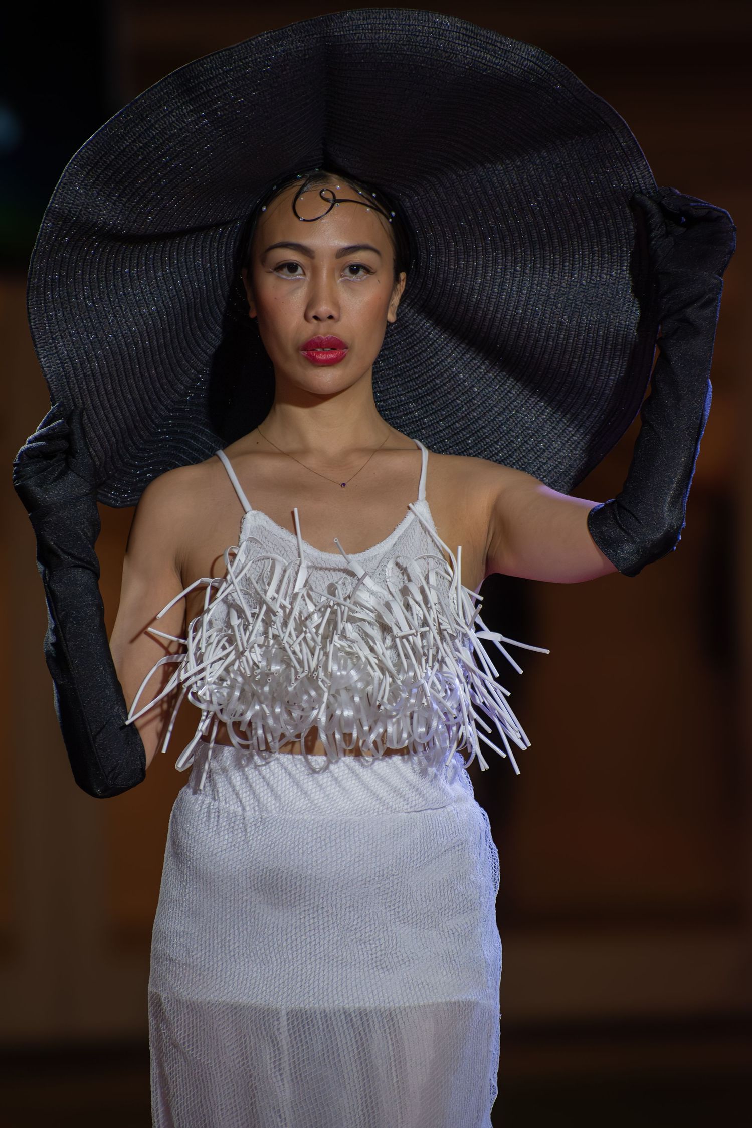 Close-up of statement accessories during a live fashion show in Brisbane.