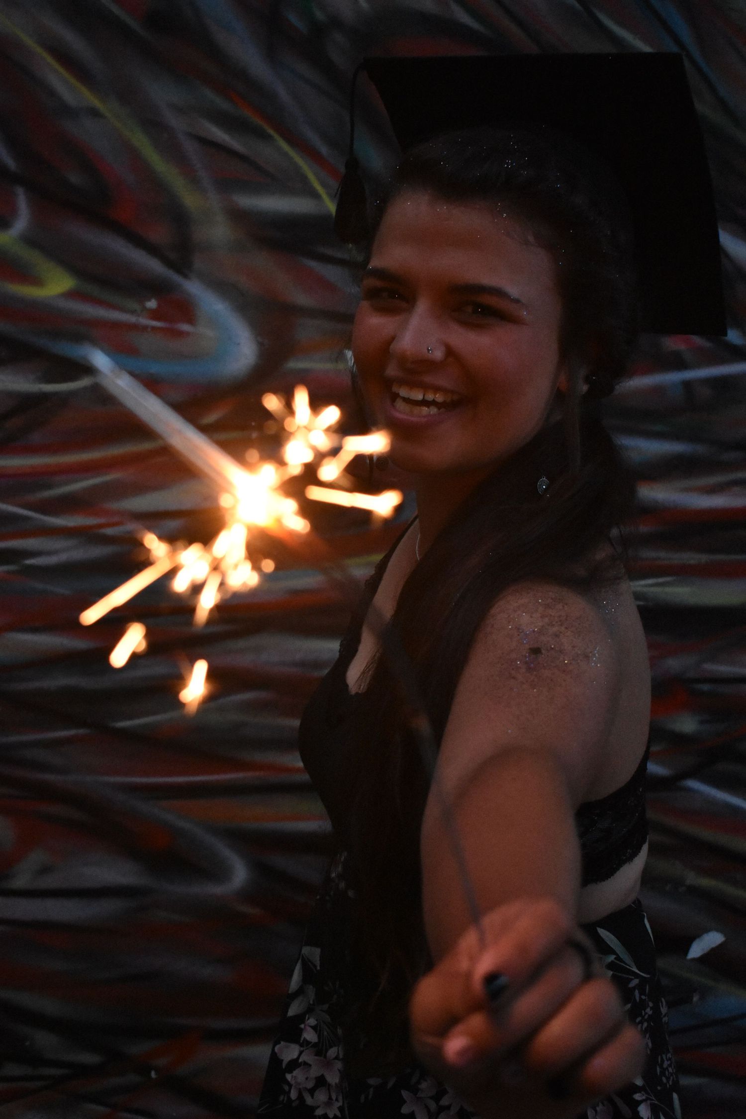 Graduate laughing for the camera.