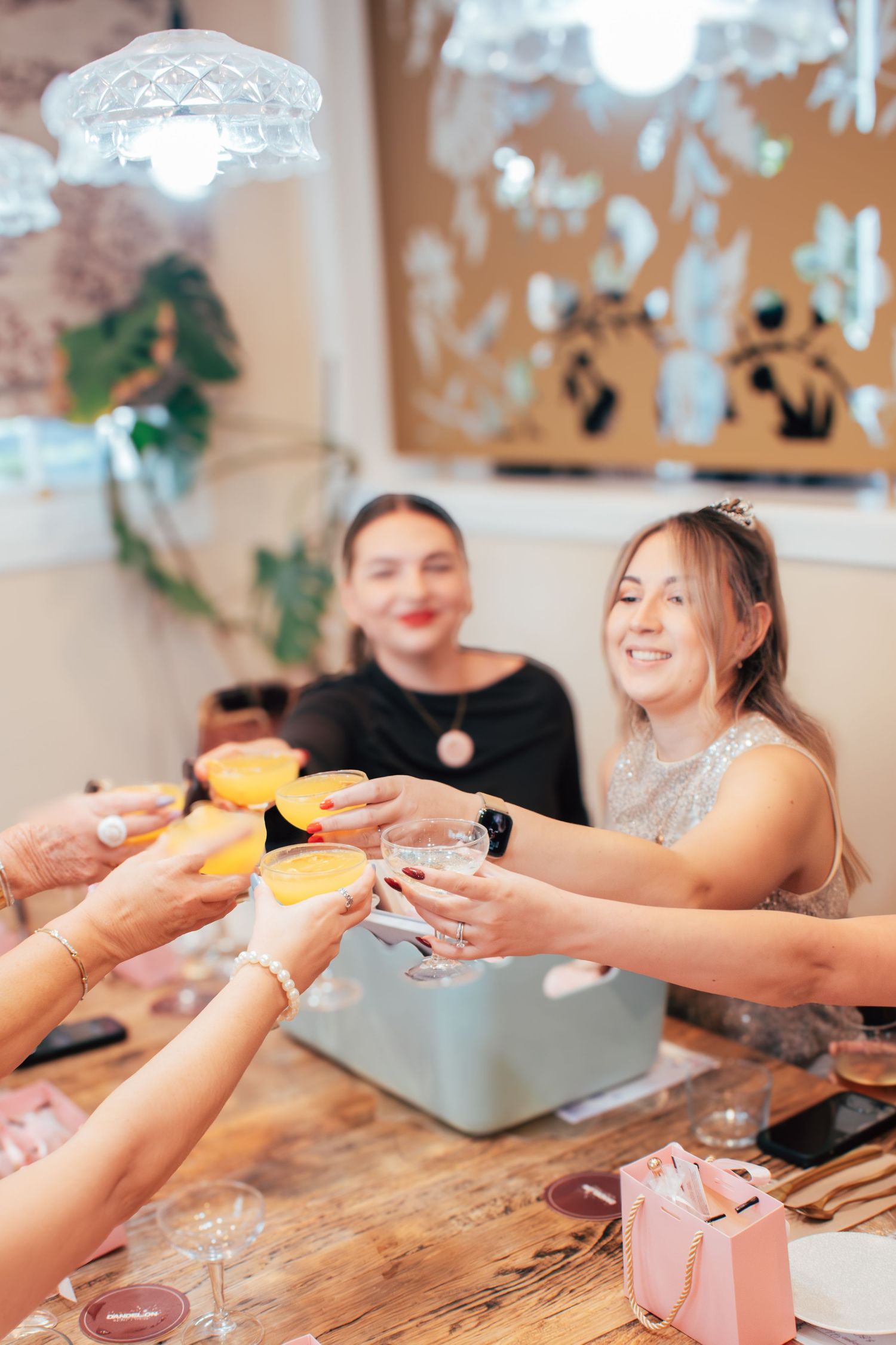 Candid picture of the bride to be being celebrated at her bridal shower.