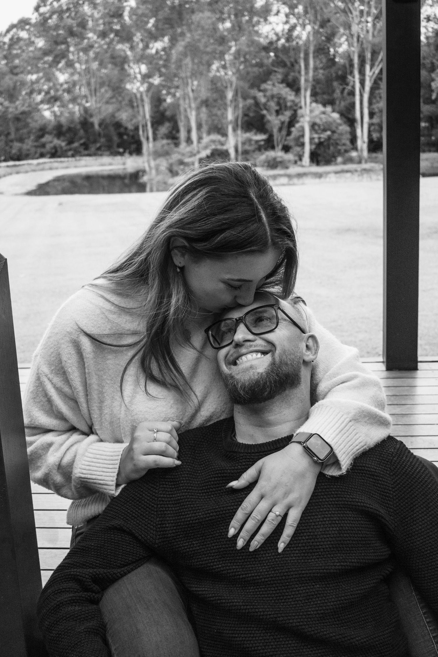 Candid photograph of a couple celebrating their engagement in Brisbane.