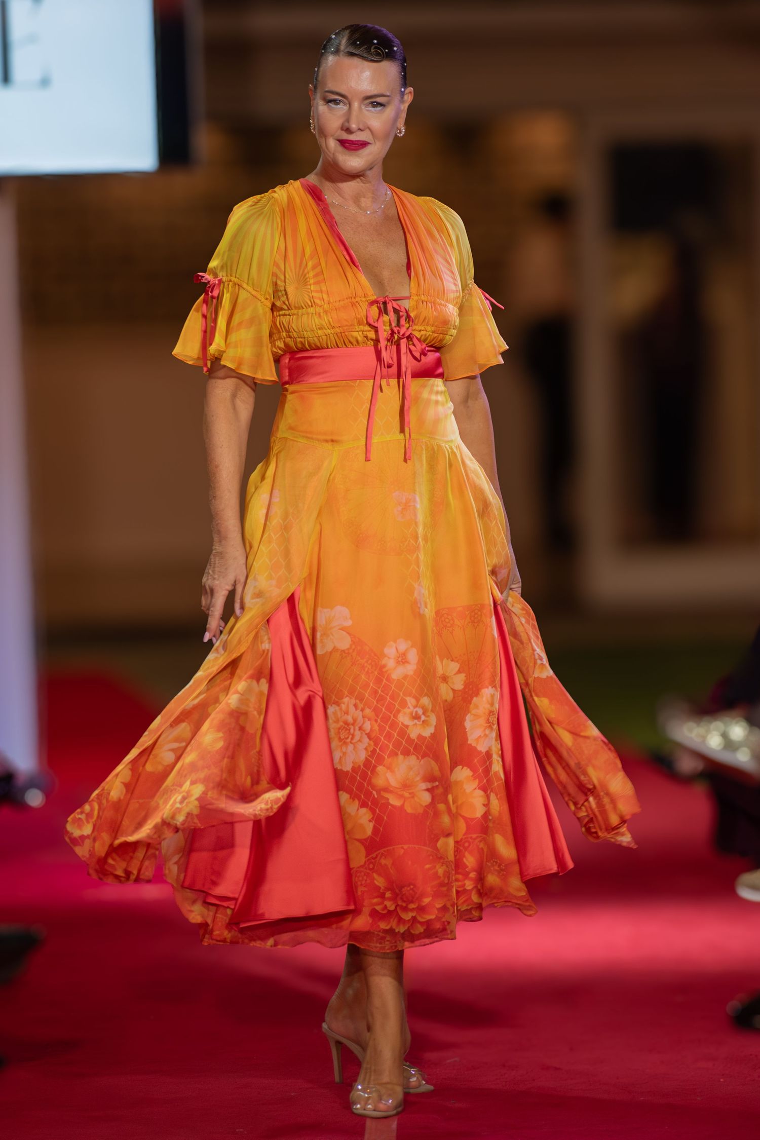Detailed photograph of a designer gown during a runway presentation in Brisbane.