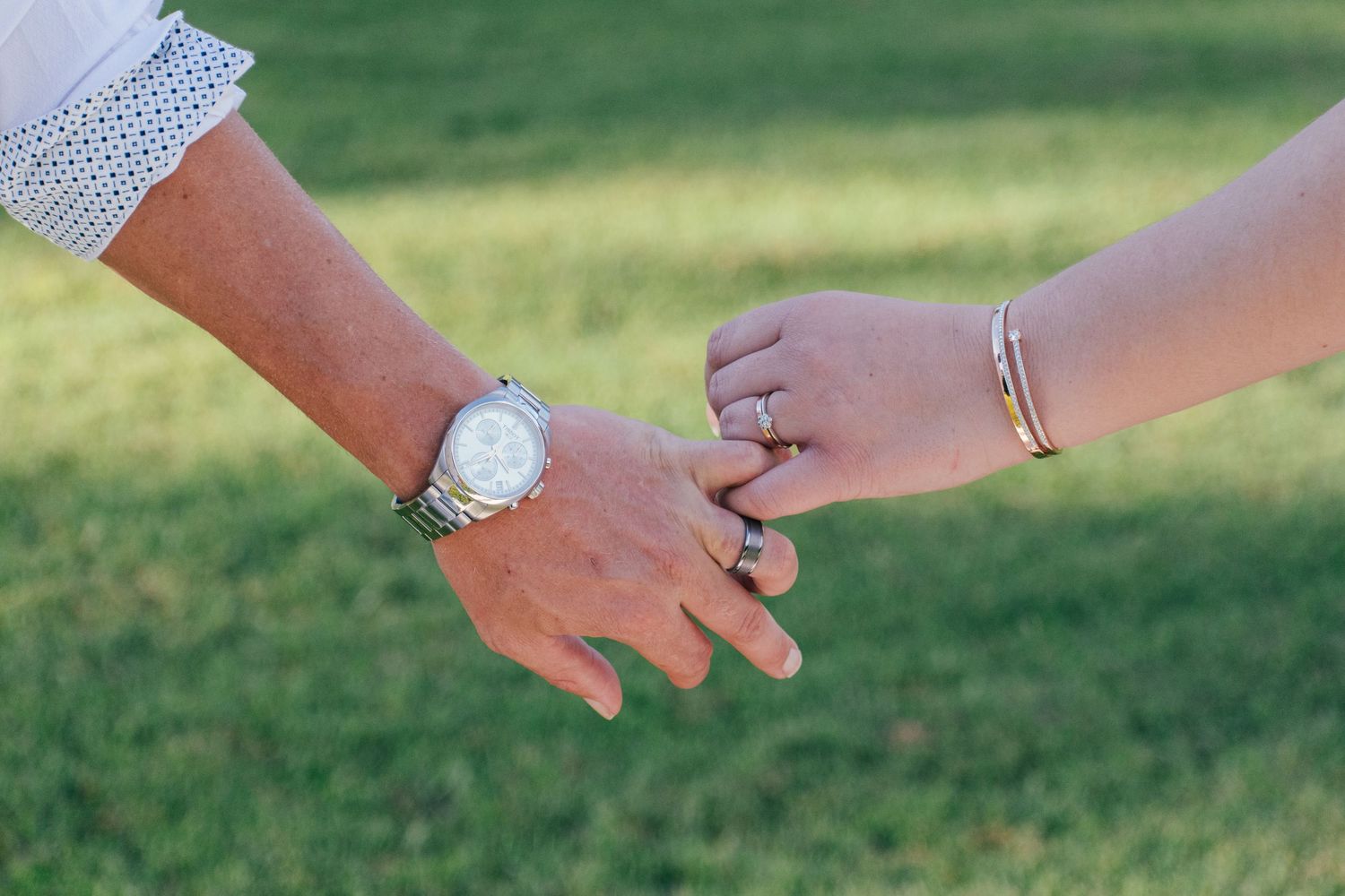 Close-up picture of the wedding bands of a couple in Brisbane.