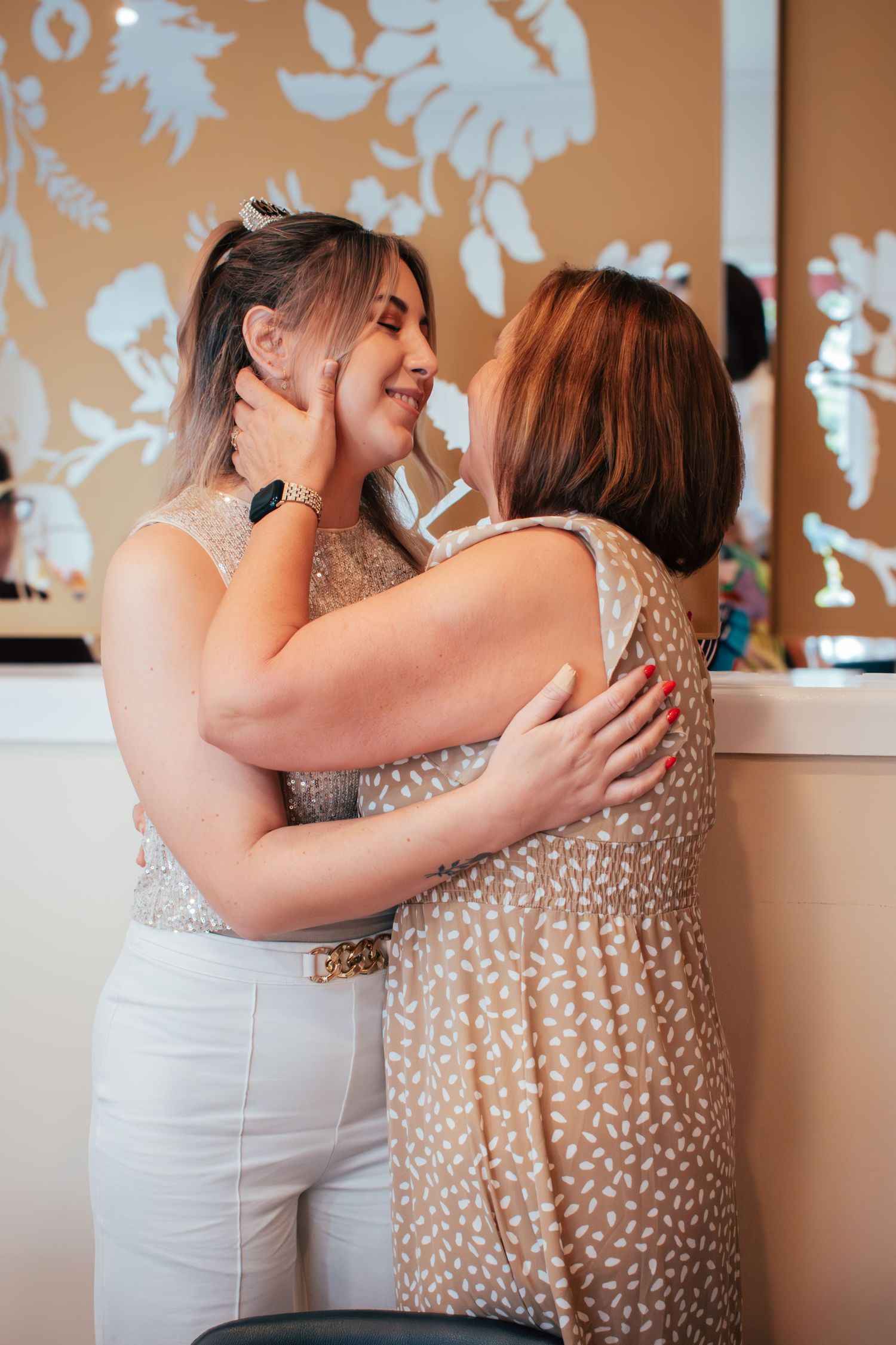 Candid photograph of the bride and her step in mom at a Brisbane bridal shower.