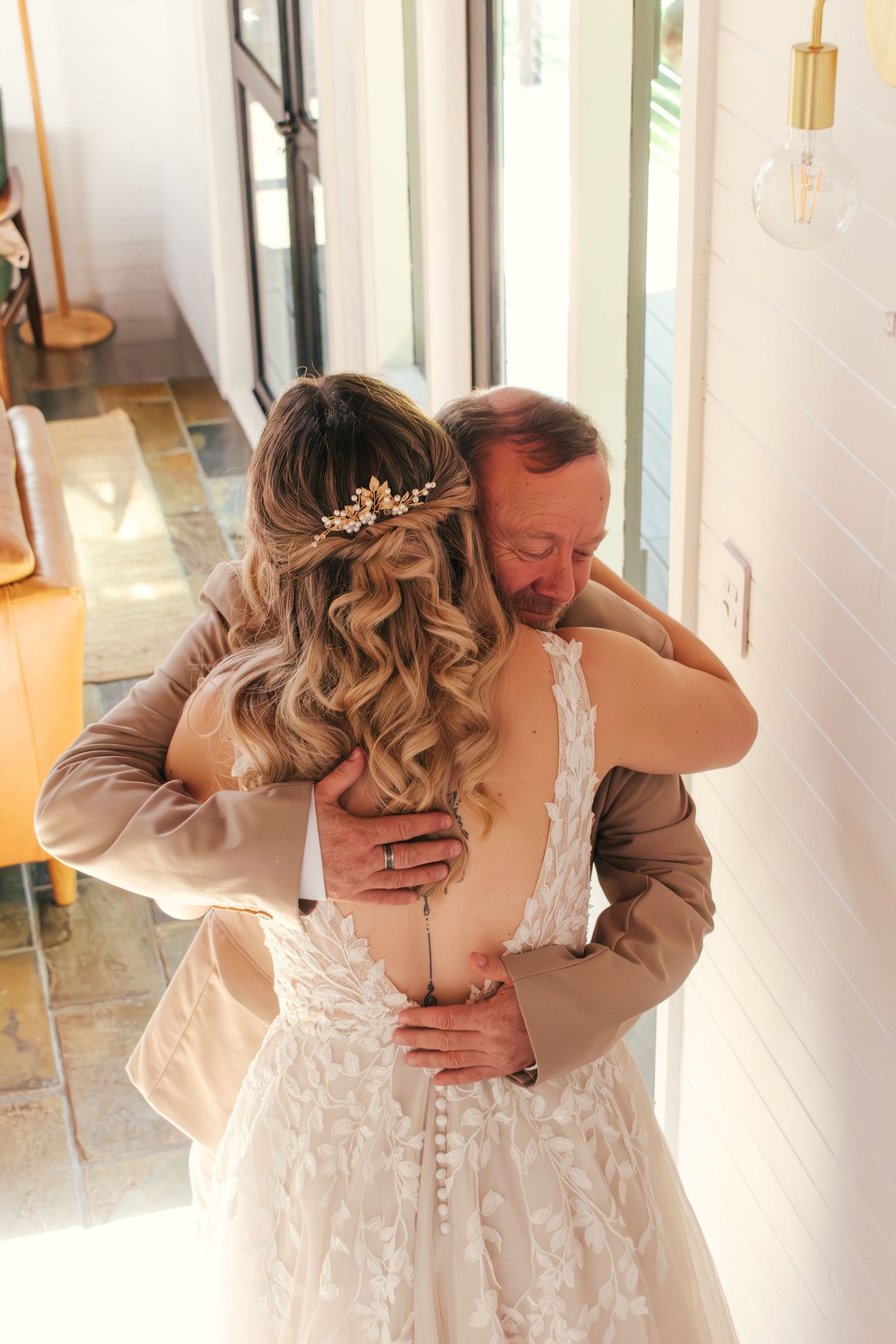 Emotional first look captured of a father and the bride on her wedding day.