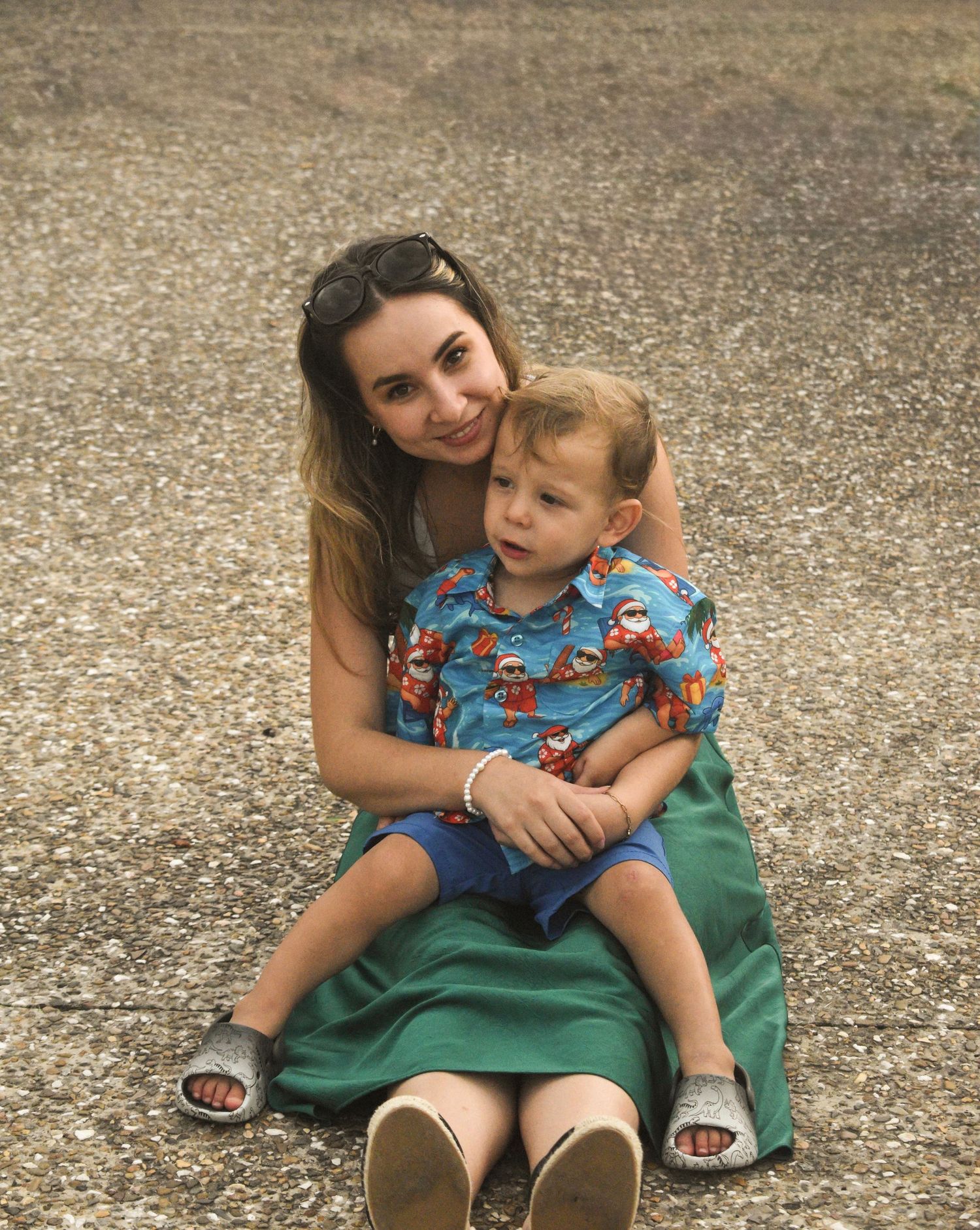 Candid picture of an aunt with her nephew laughing at a family Christmas party.