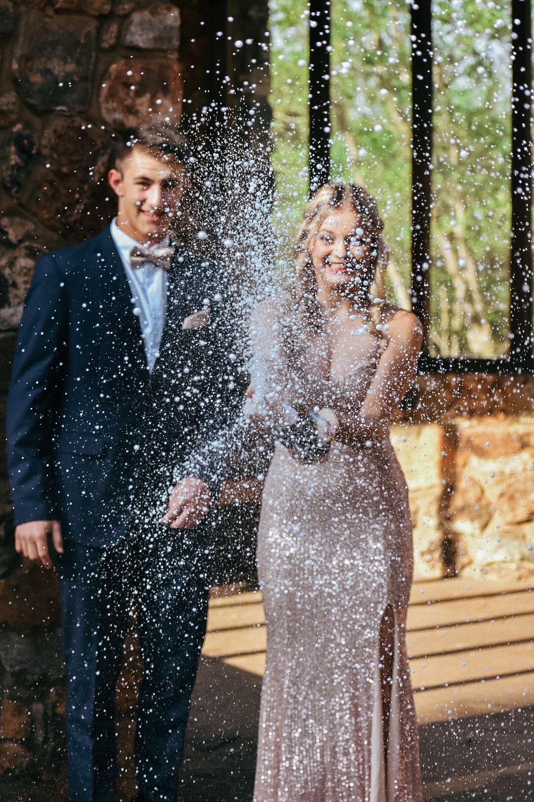 A couple of friends celebrating their dance with champagne in Pretoria, South Africa.