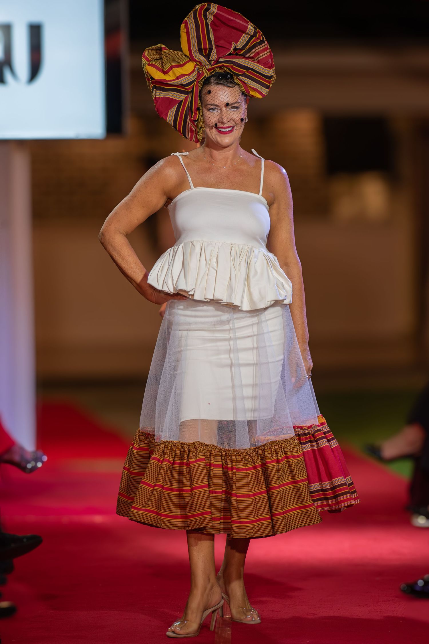 Detailed photograph of a designer gown during a runway presentation at a Brisbane event.