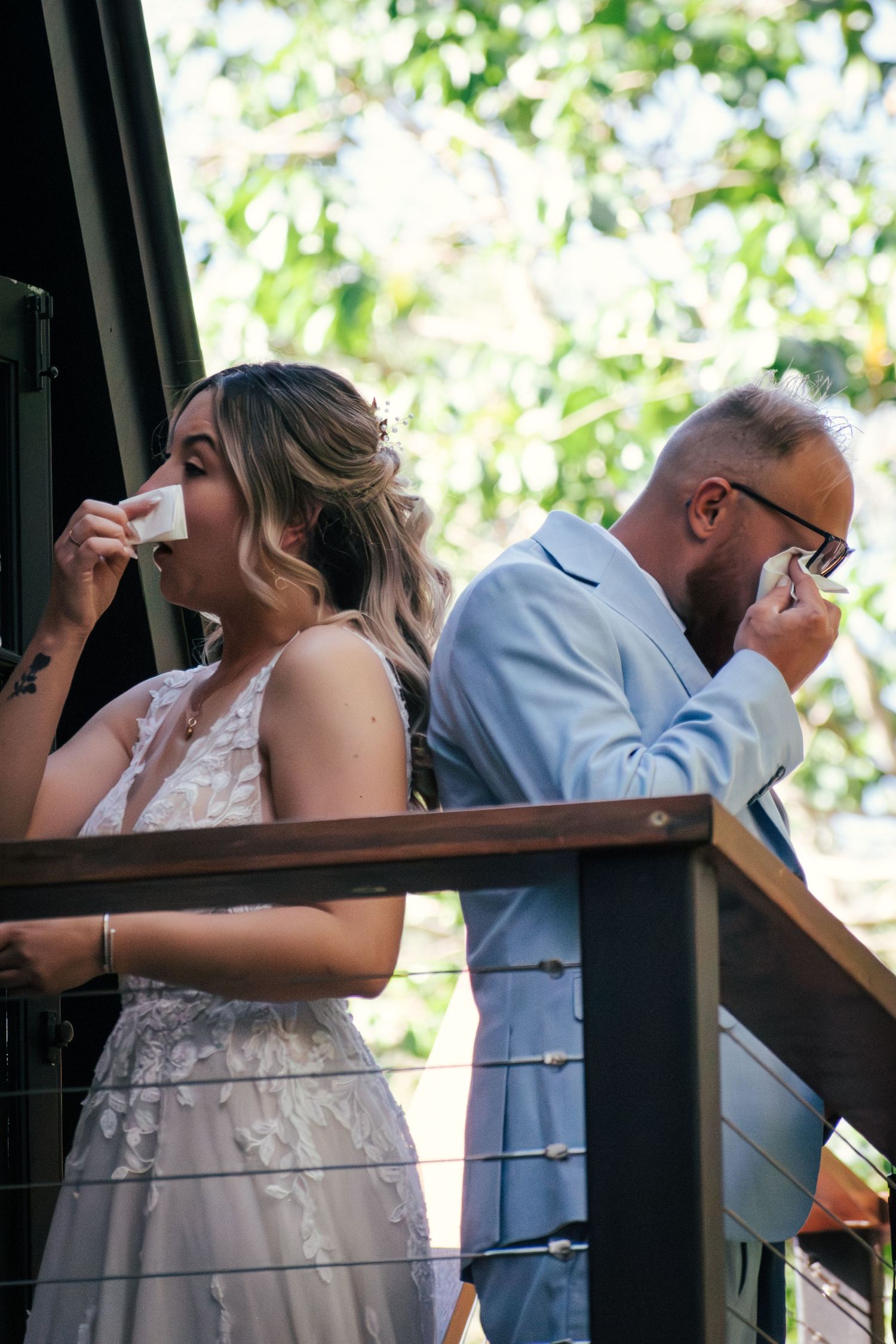 Emotional first touch and sharing of vows captured on their wedding day.