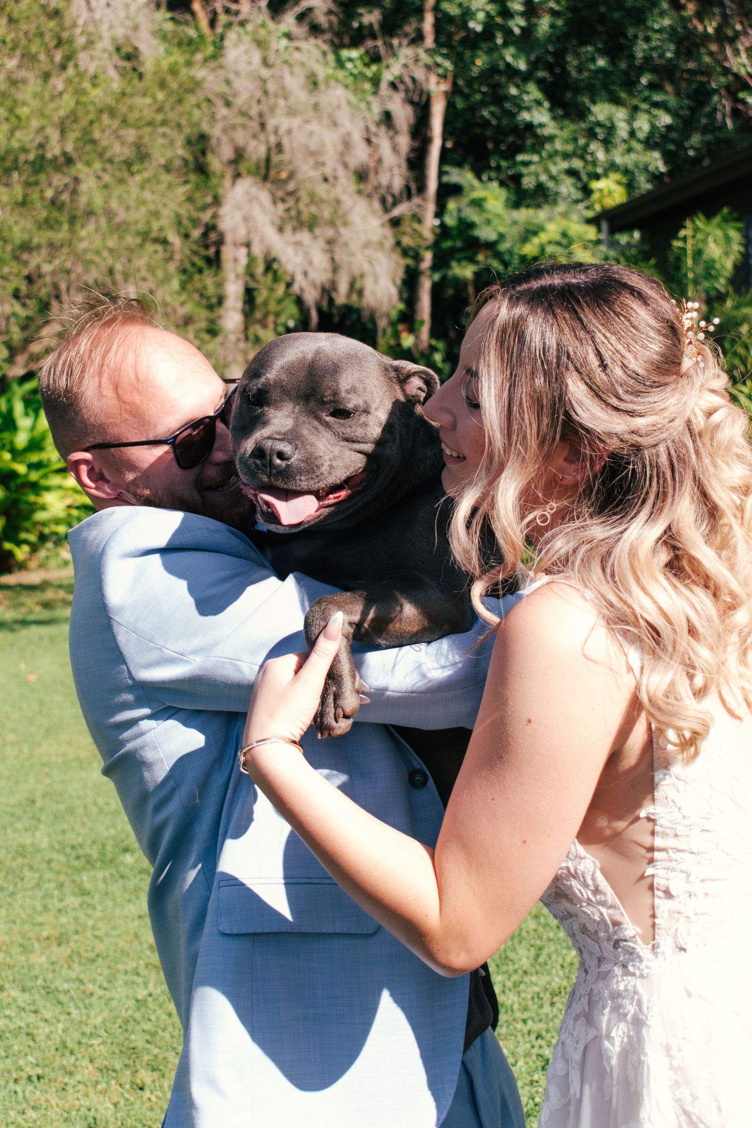 Candid picture of the couple and their fur baby after tying the knot.