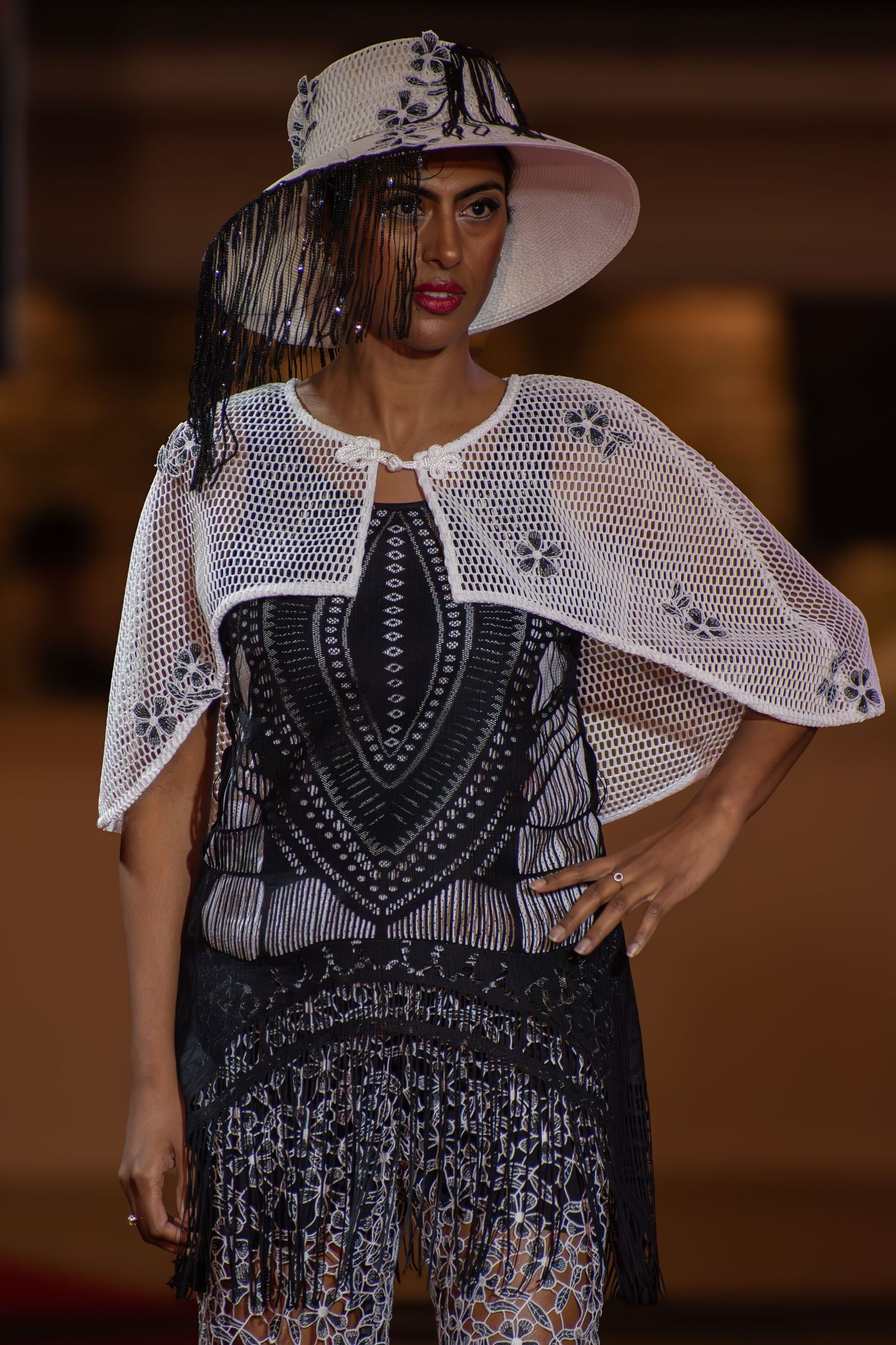 Close-up of statement accessories during a live fashion show.