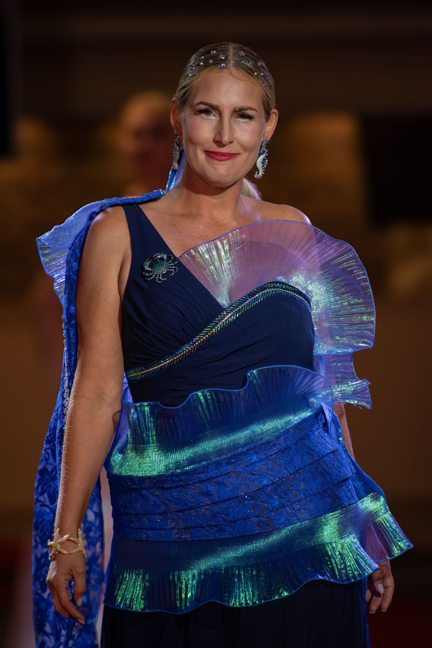 Detailed photograph of a designer gown during a runway presentation.