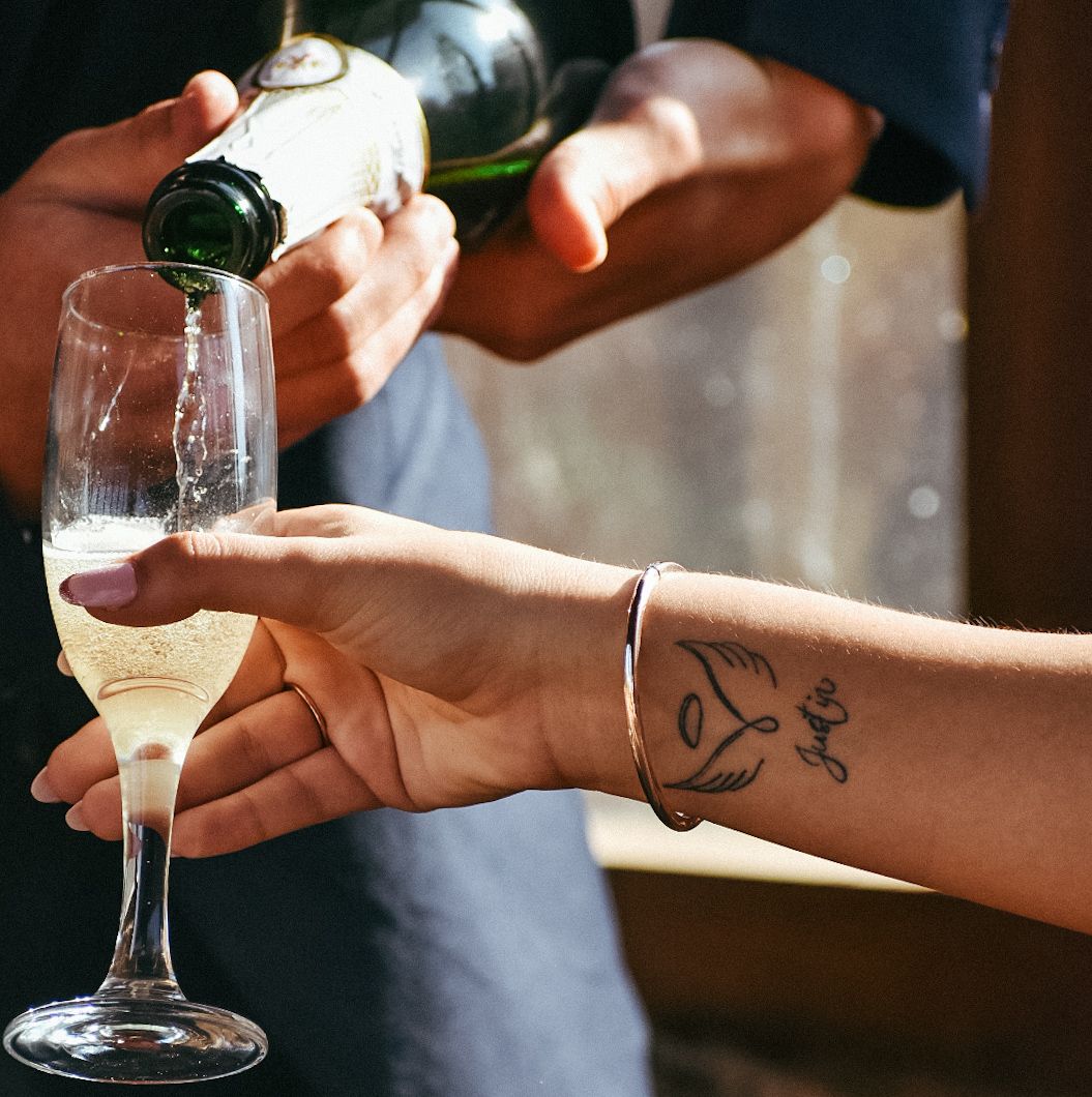Celebrating with champagne whilst paying tribute to a loved one lost in Pretoria, South Africa.