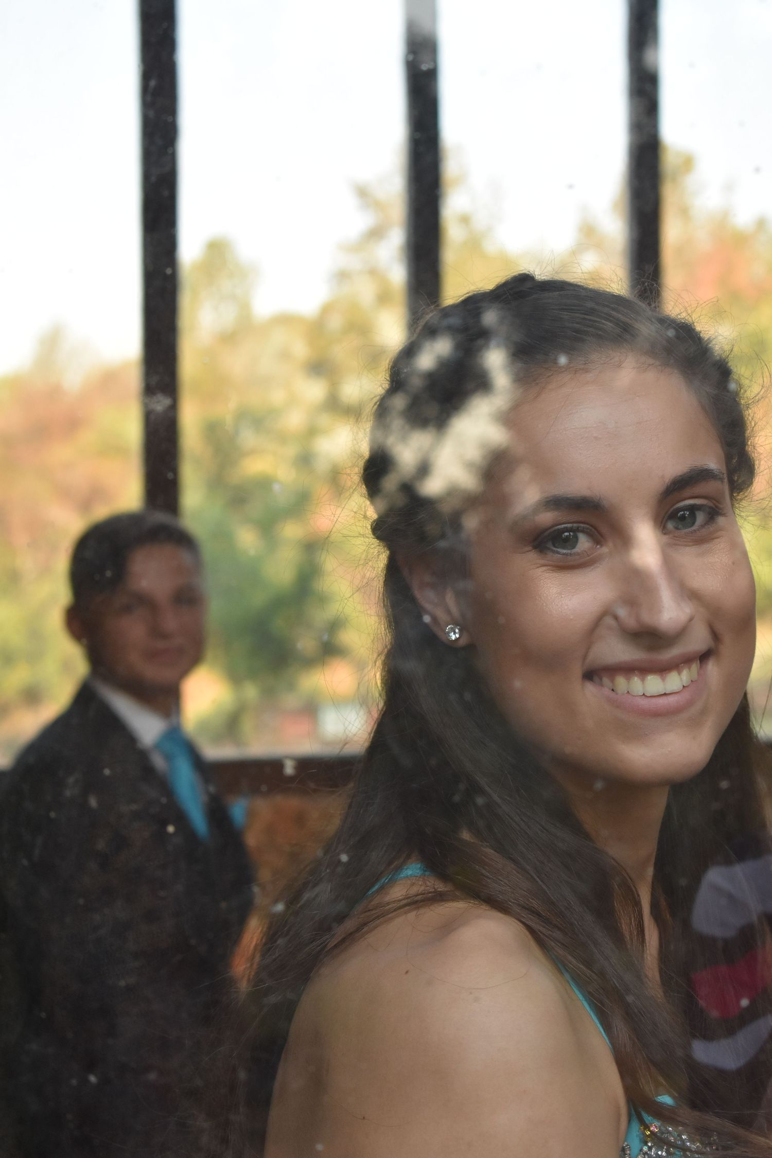 A couple of friends laughing on their way to their dance.