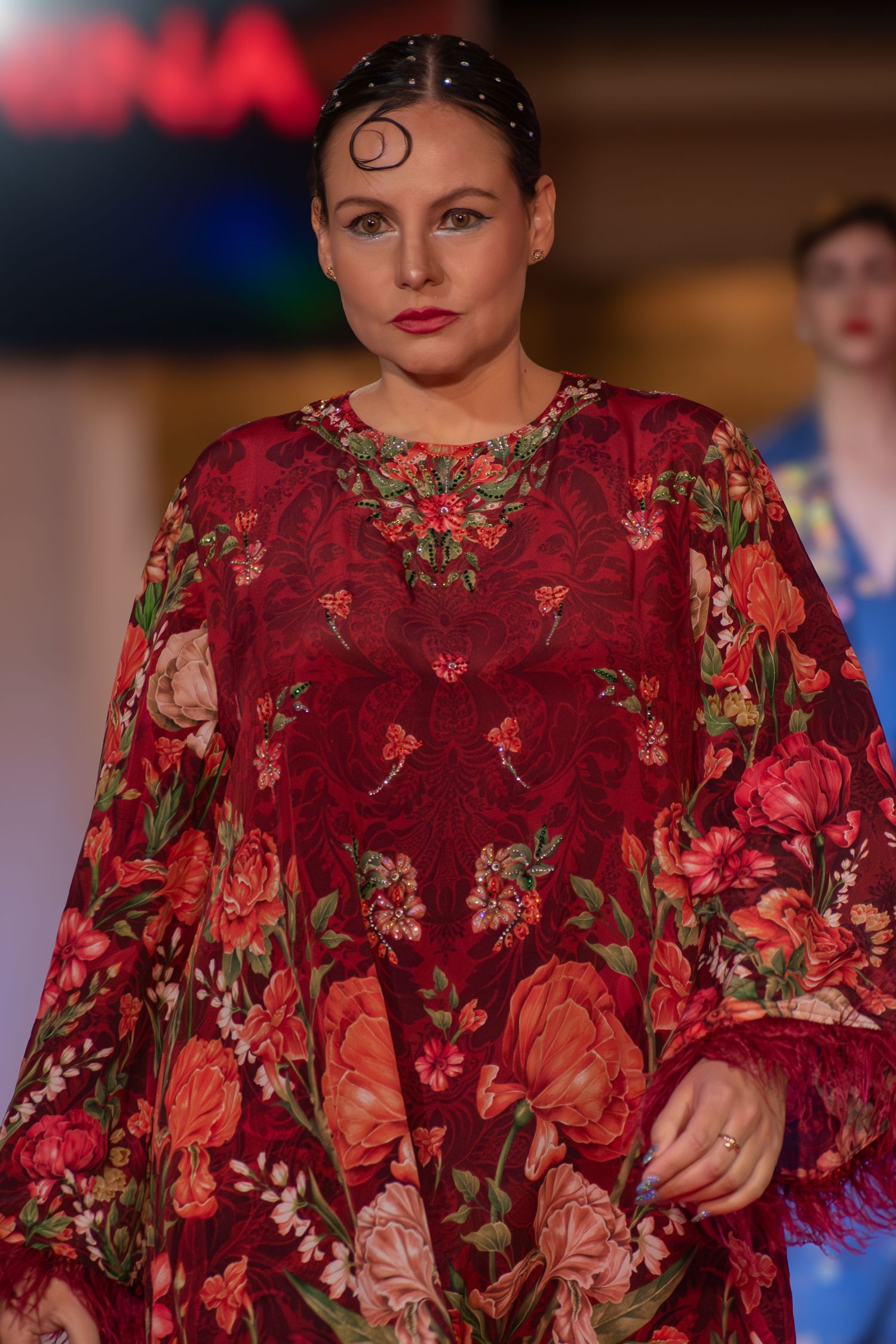Close-up of a statement piece during a live fashion show.