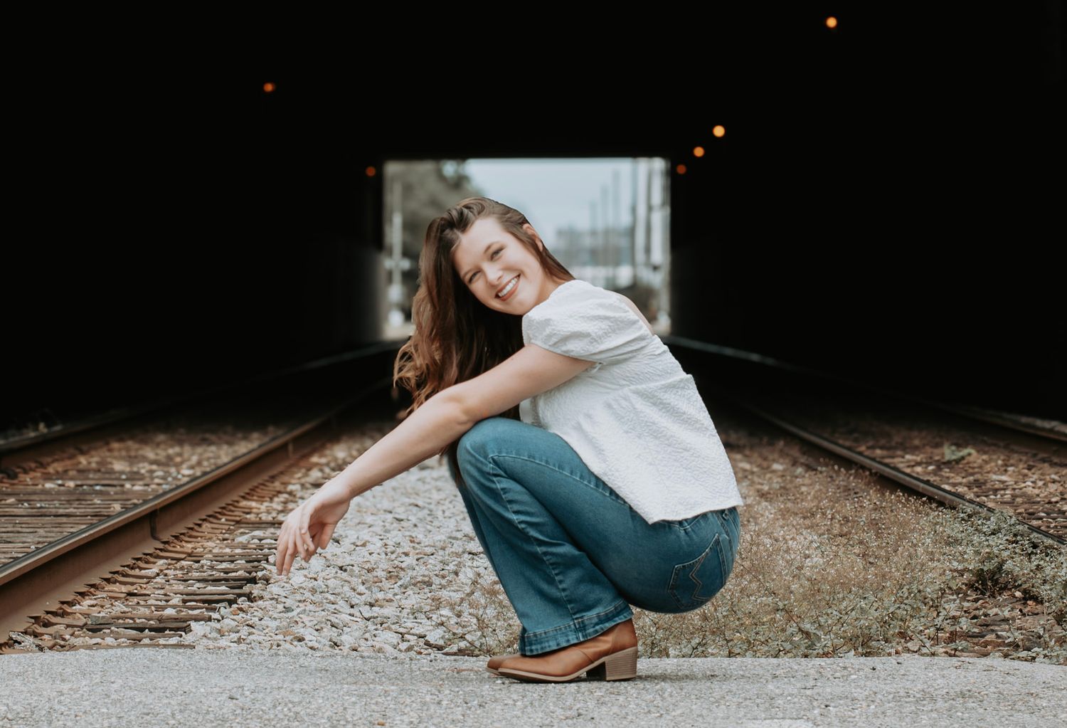 Senior Teen posing for Senior Portraits downtown Huntsville, AL
