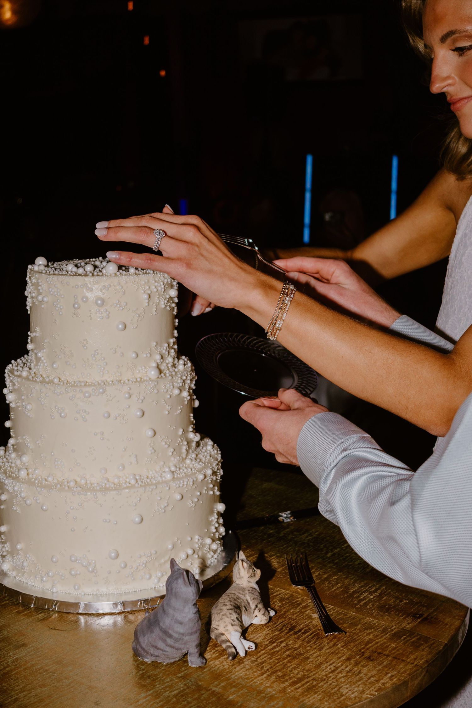 Bride and groom cutting their wedding cake together during the reception