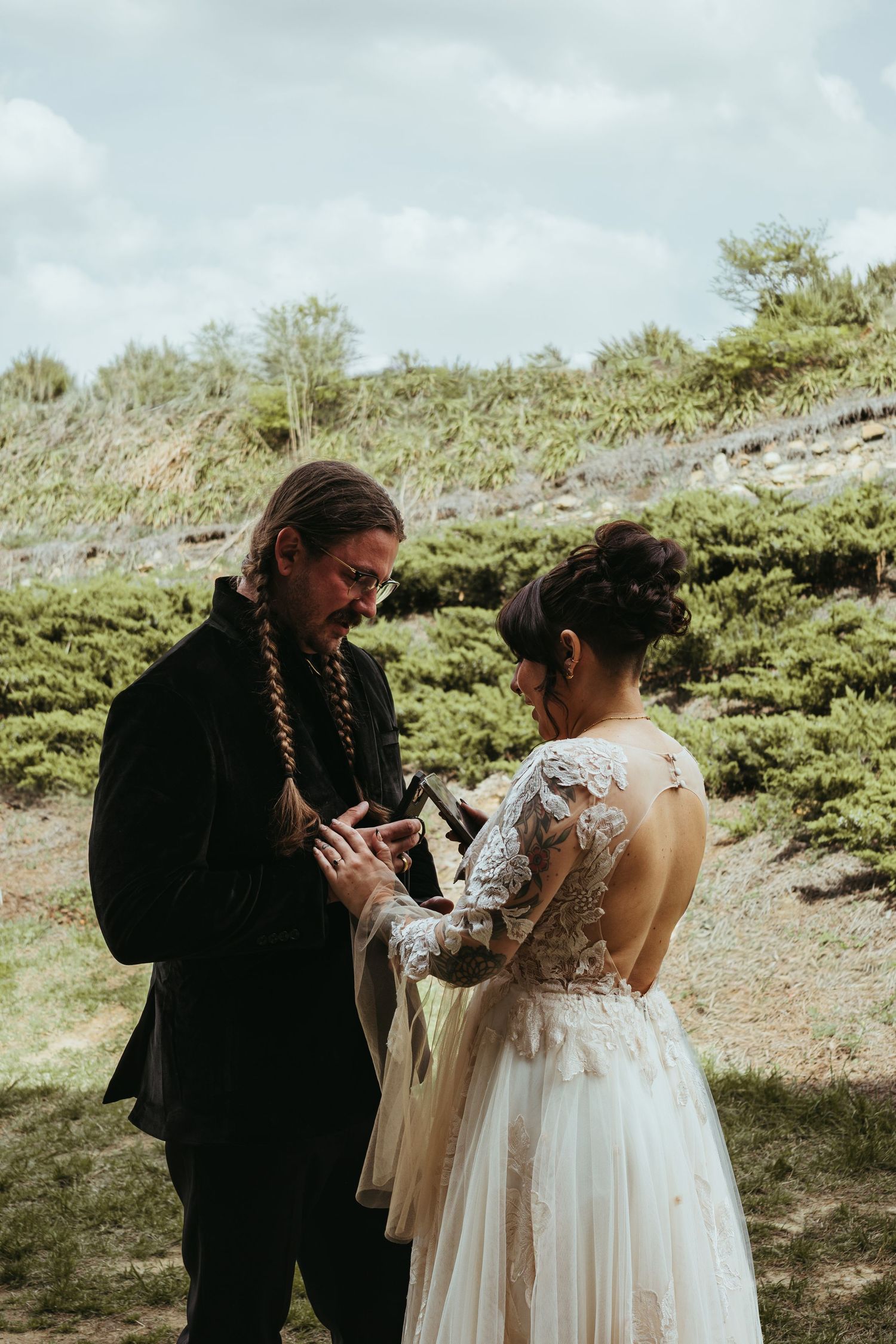 bride and groom having a personal private vows reading