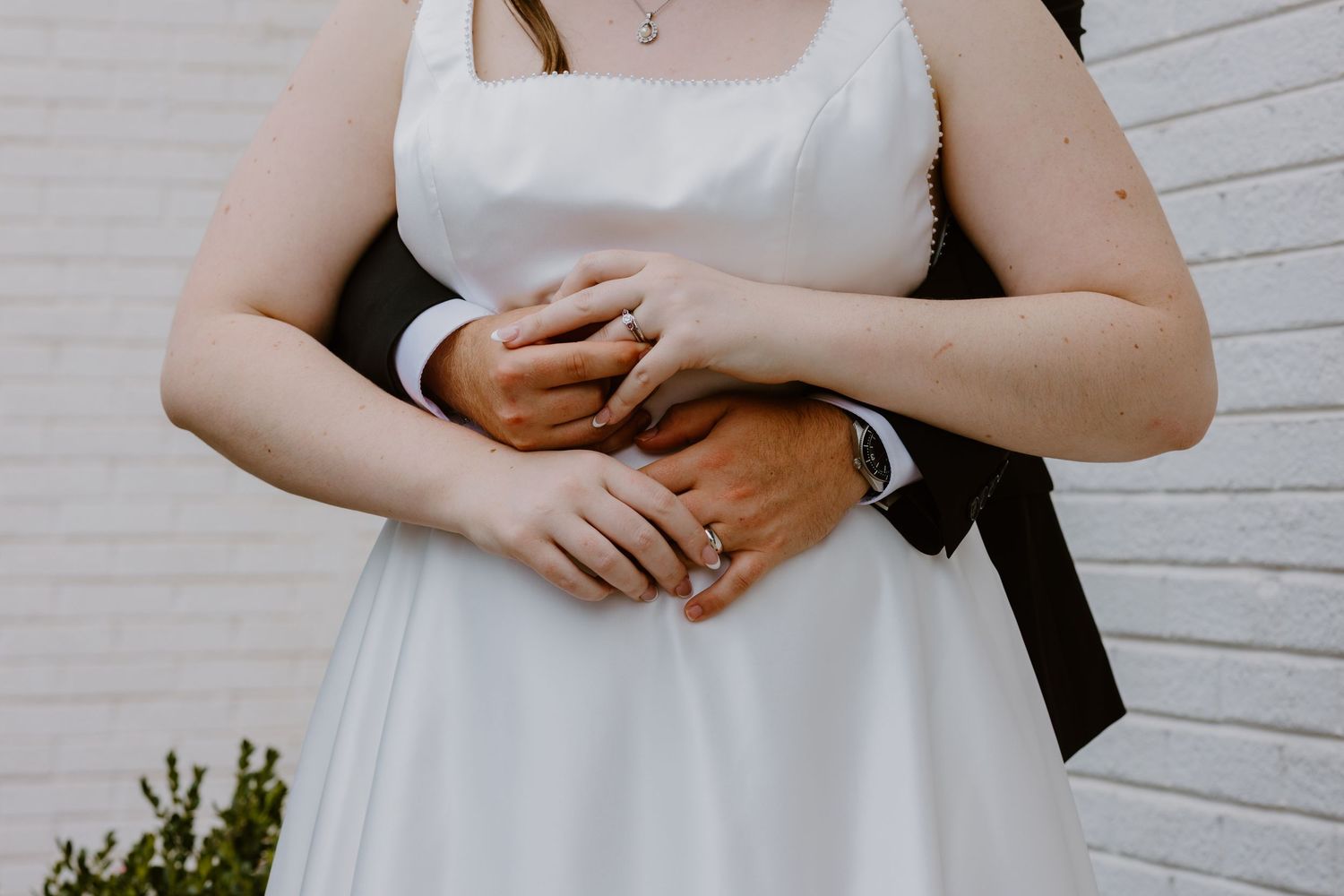 Bride and groom putting rings