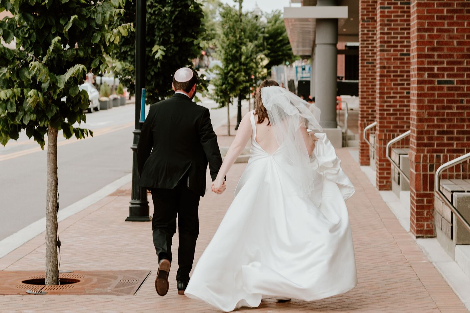 couple running away downtown together