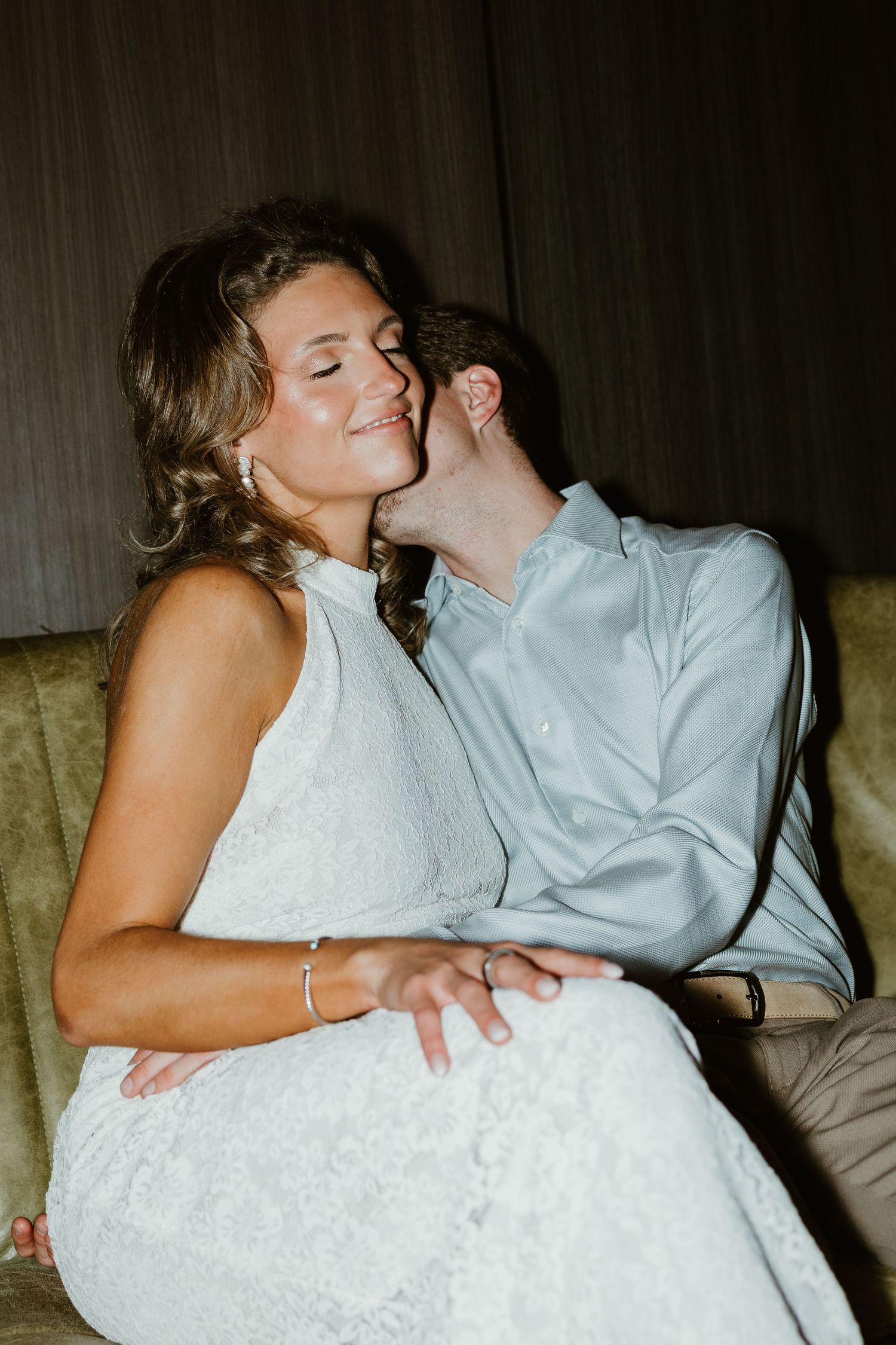 groom kissing on brides neck