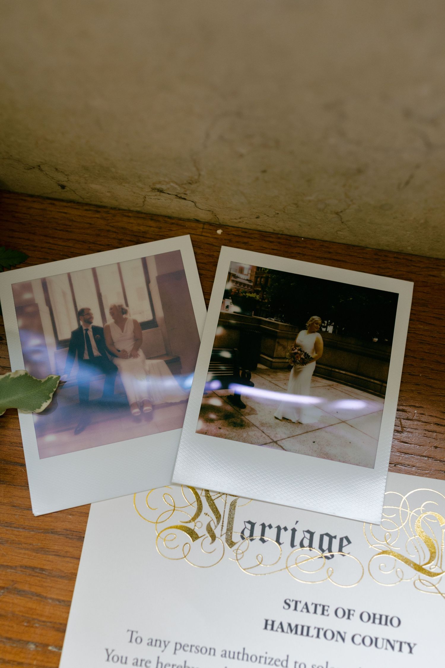 Polaroid wedding photos displayed on marriage certificate from Hamilton County, State of Ohio.