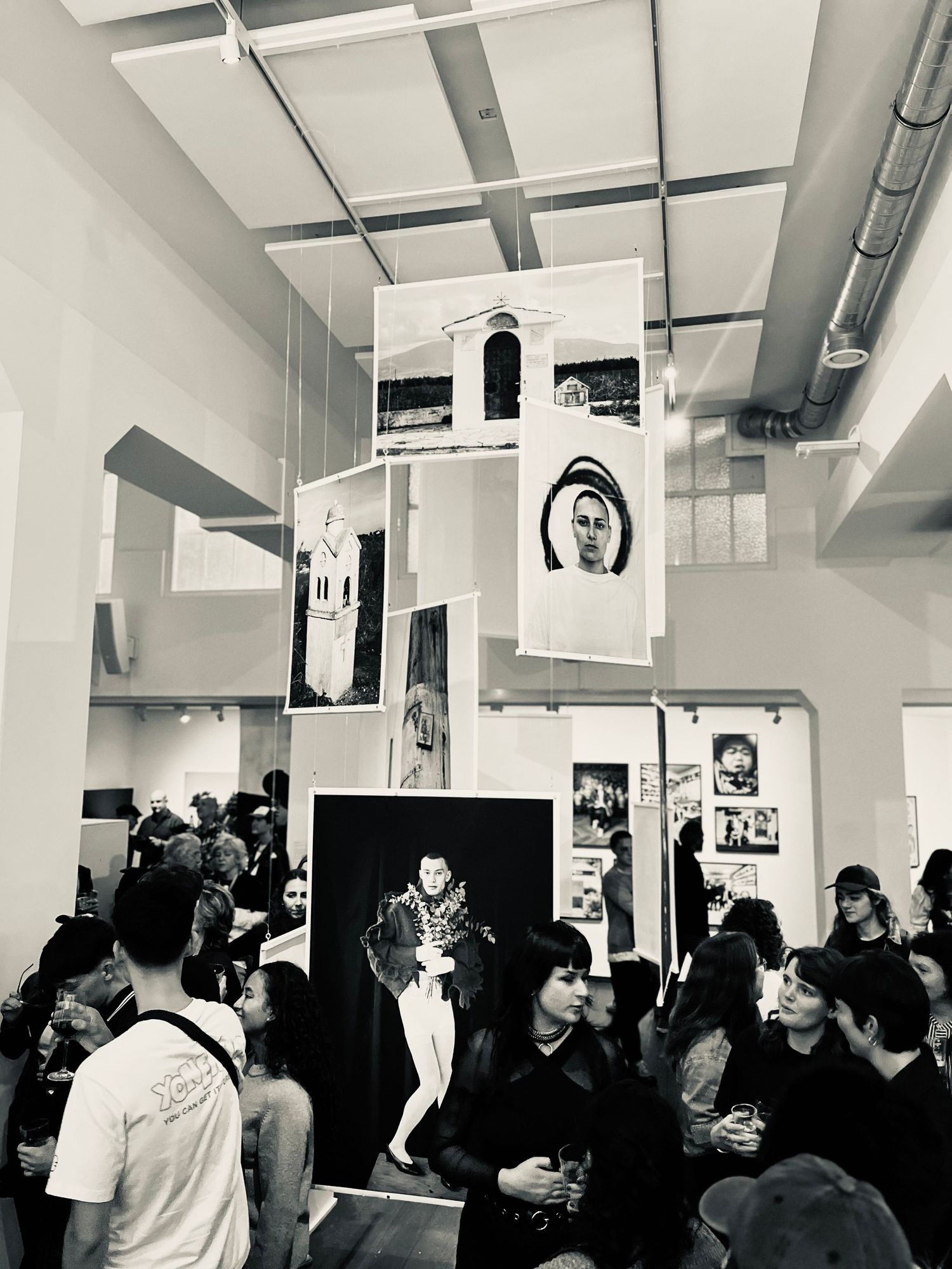 Visitors exploring the gallery, photography capturing creators sharing their work