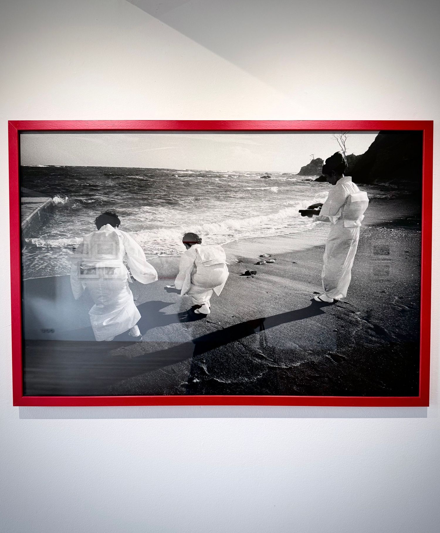 Interior gallery photography of displayed artwork, authentic brand visuals captured on iPhone