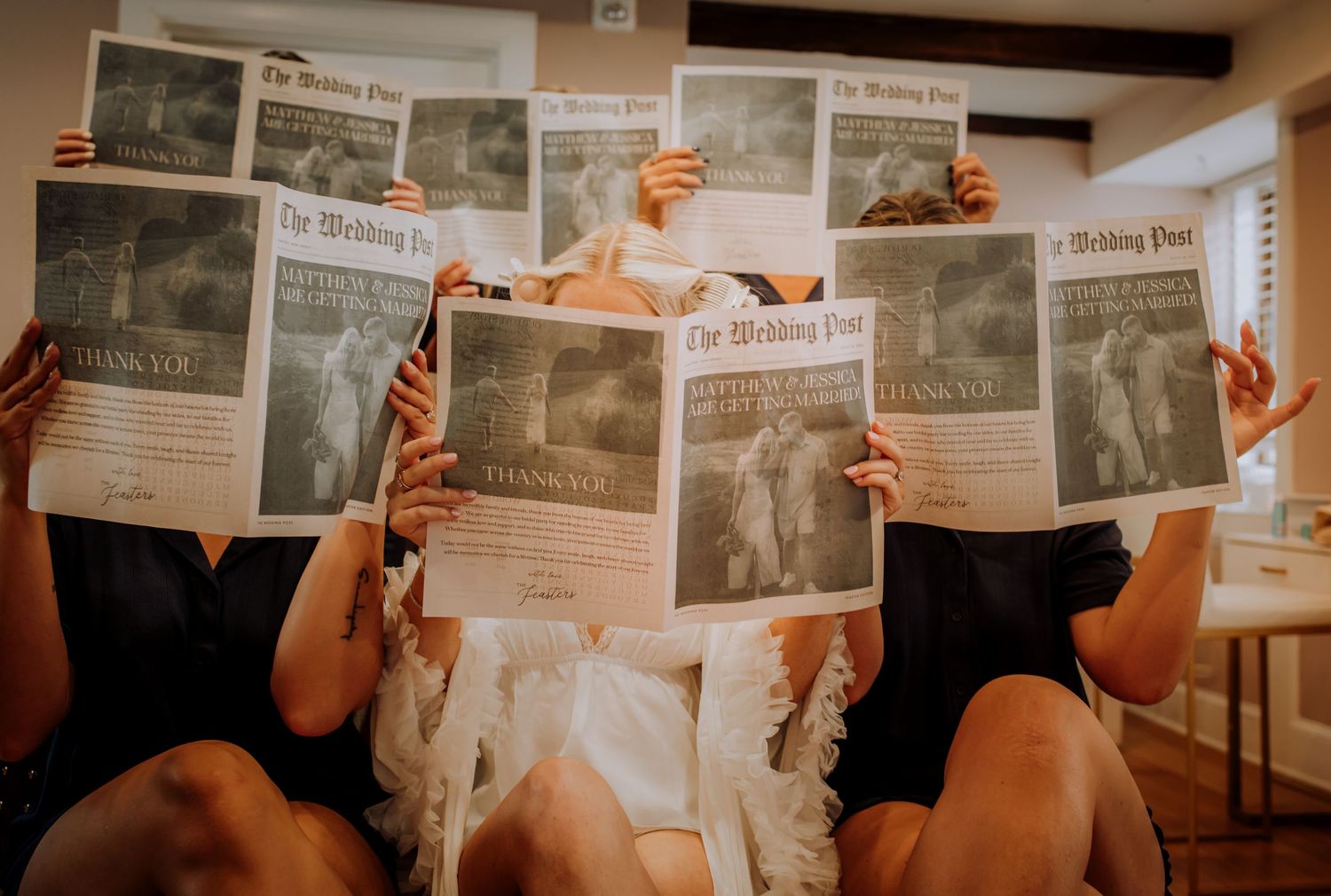 A creative sequence of newspaper reading shots showing multiple angles of hands holding newspapers.