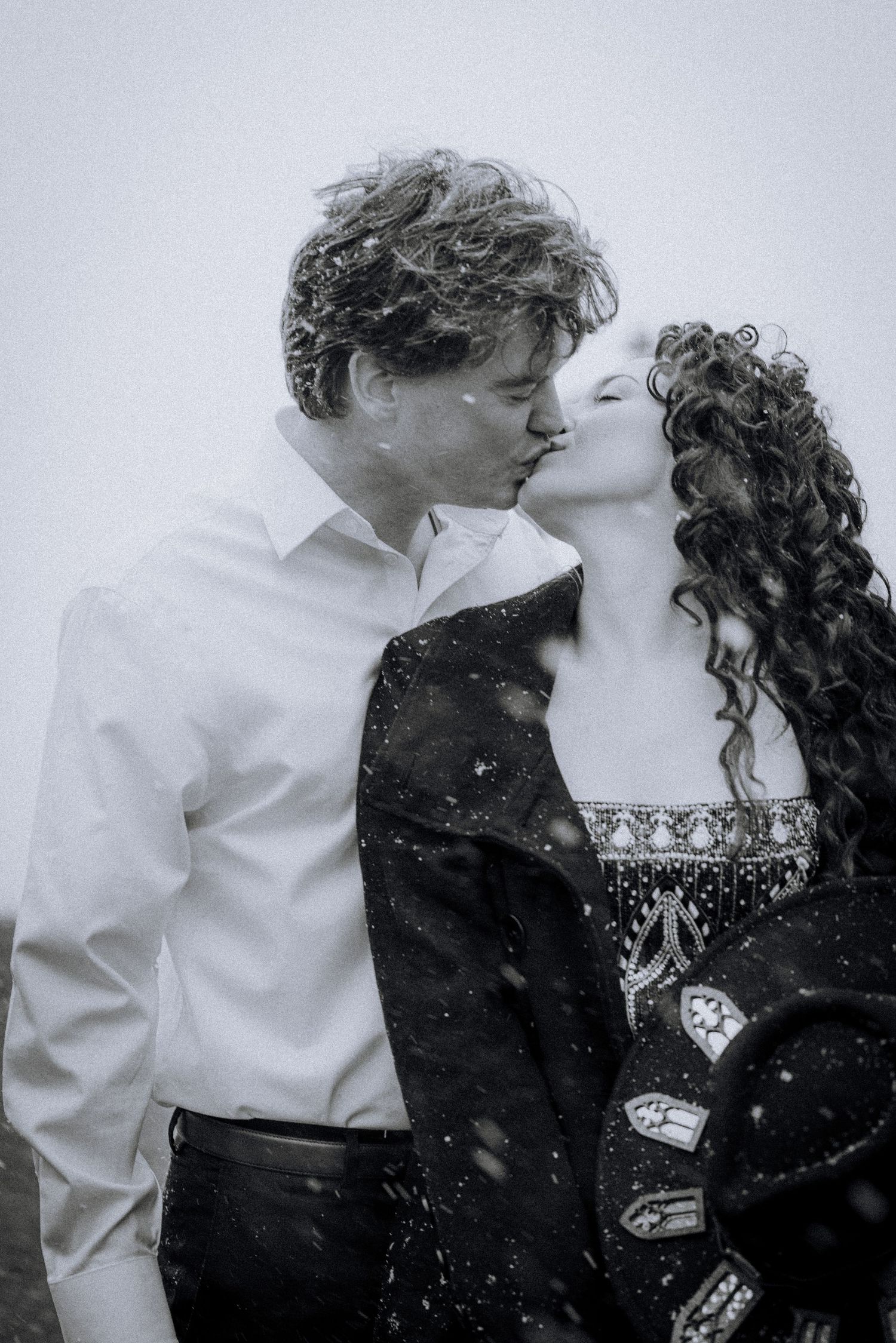 A romantic black and white photo sequence capturing tender moments between a couple.