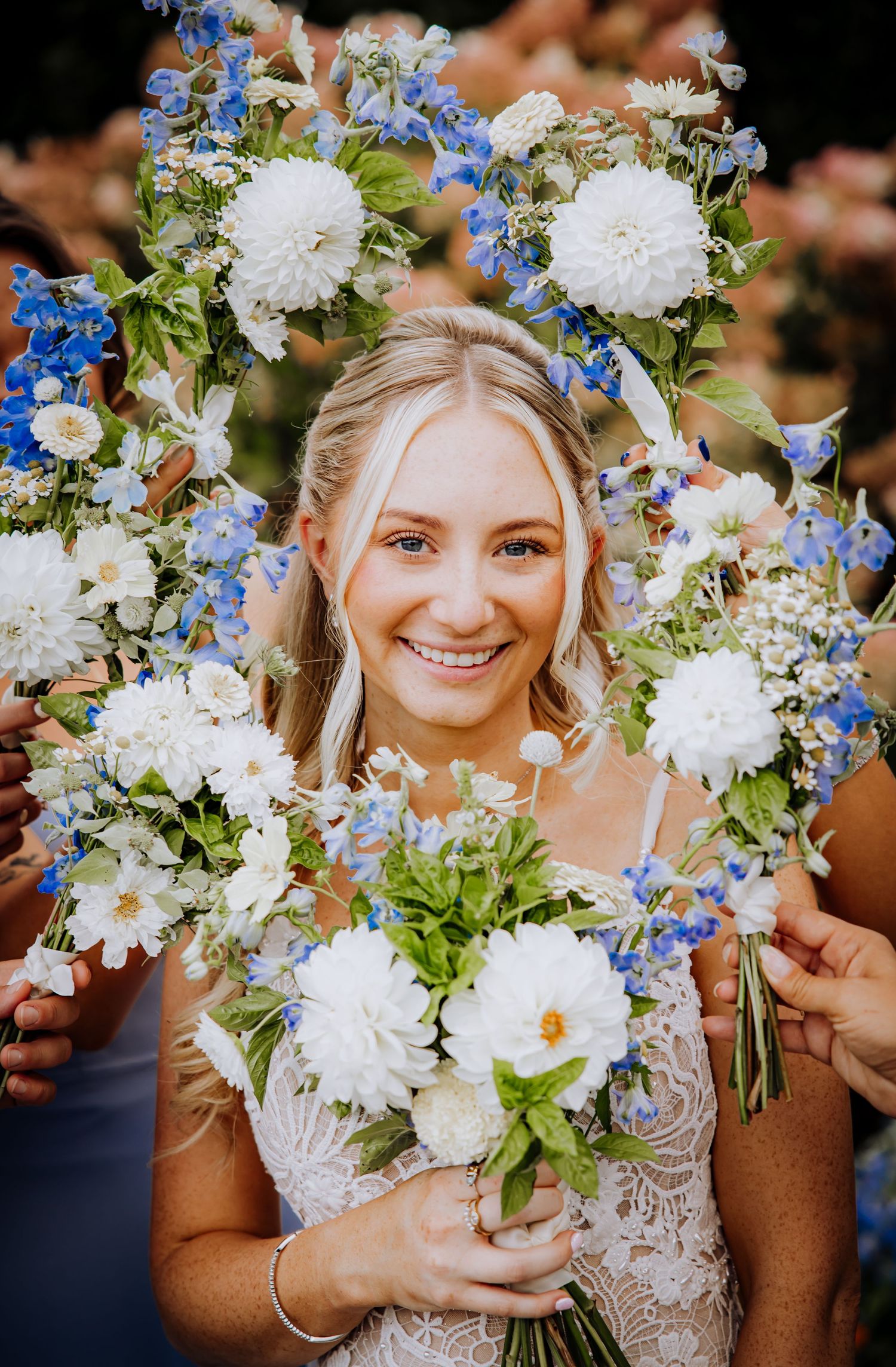 Beautiful floral arrangement featuring white and blue flowers framing a joyful moment.