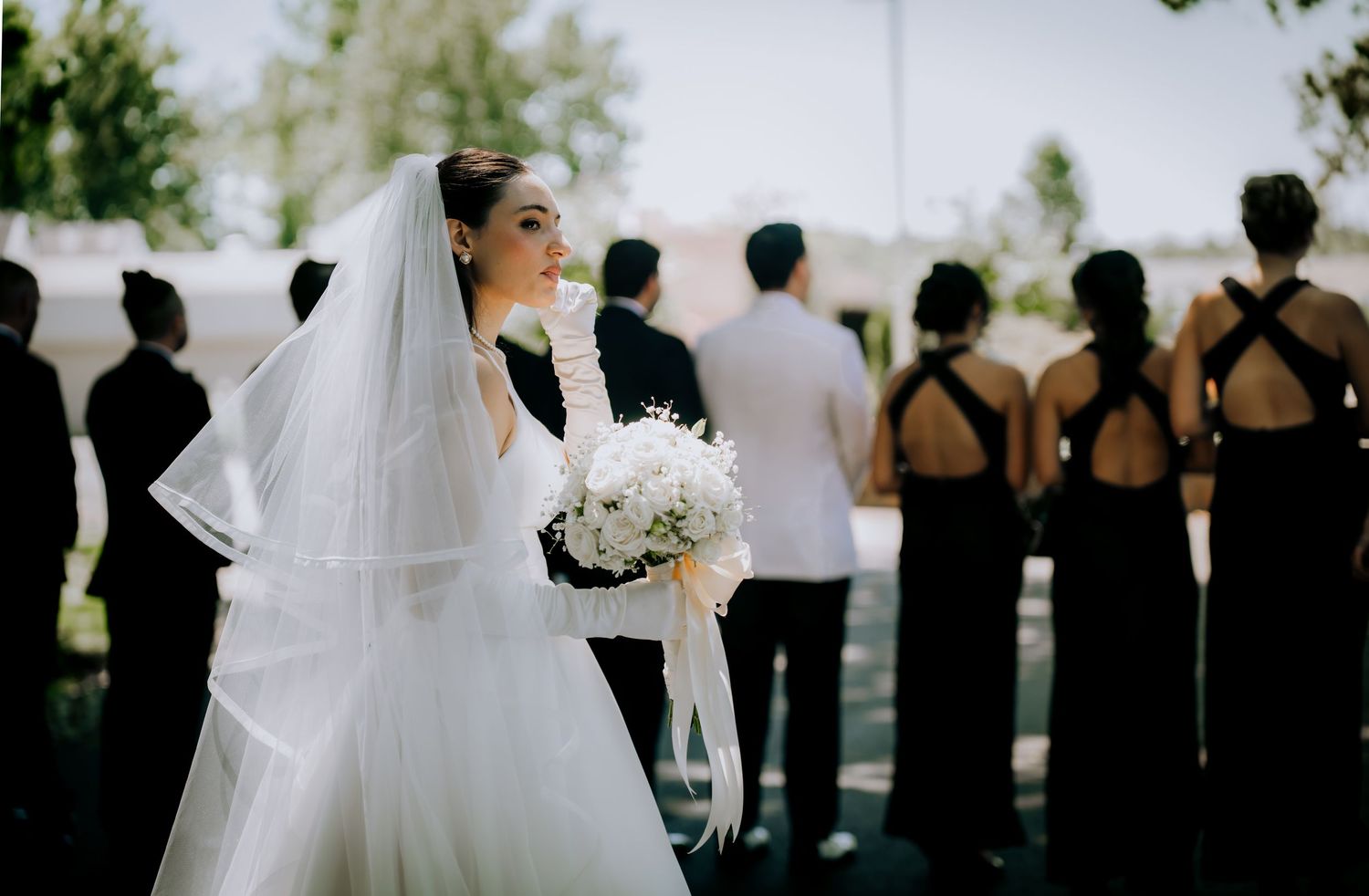 A collection of black and white wedding photos showing silhouettes of the wedding party against bright outdoor lighting.Editorial and Cinema