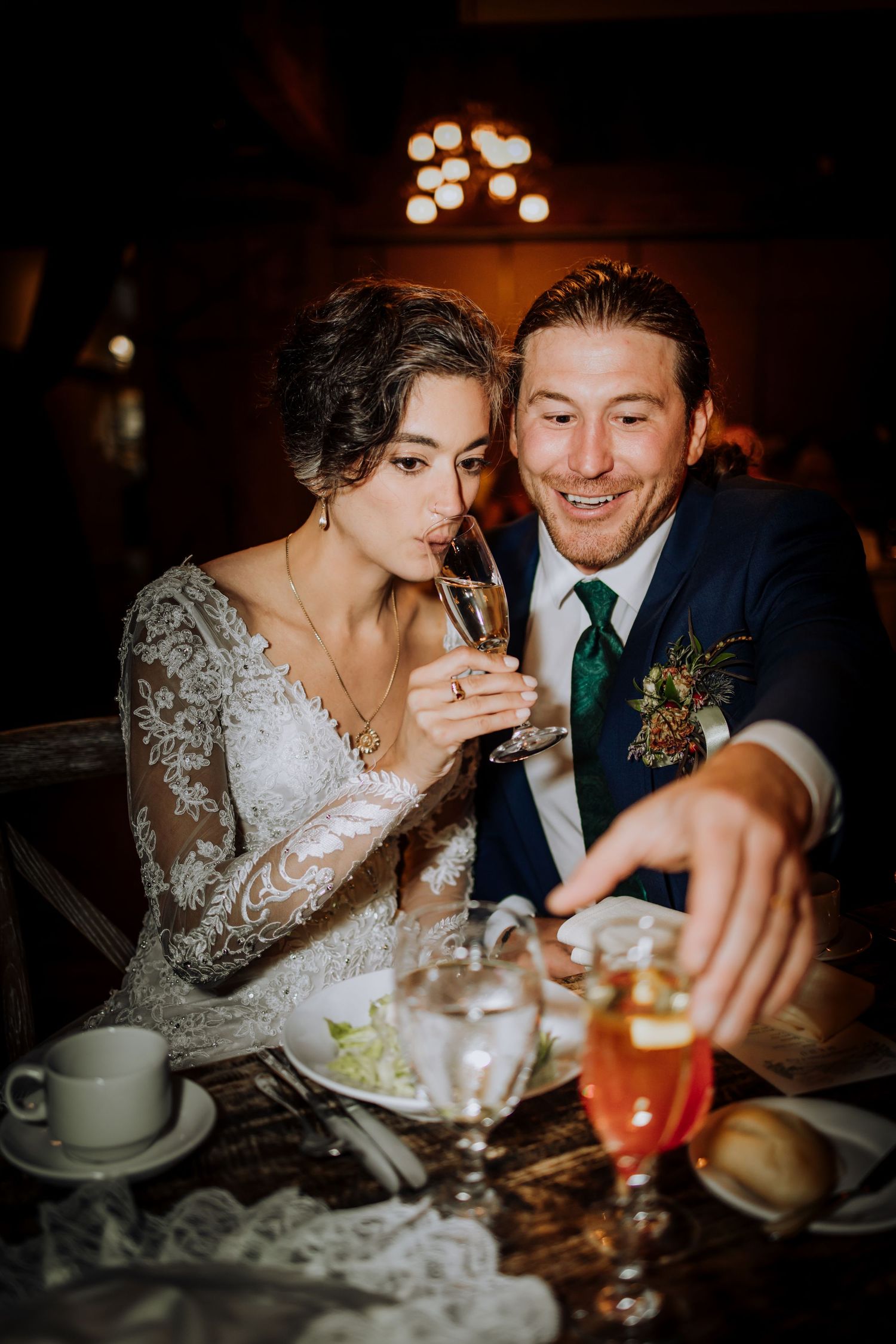 Intimate candlelit reception moments with cocktails and elegant table settings.