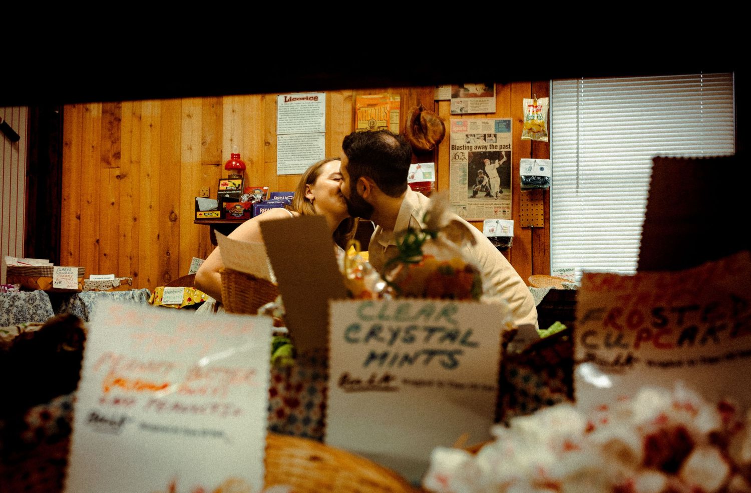 Close-up view of vintage candy store display signs and price tags.
