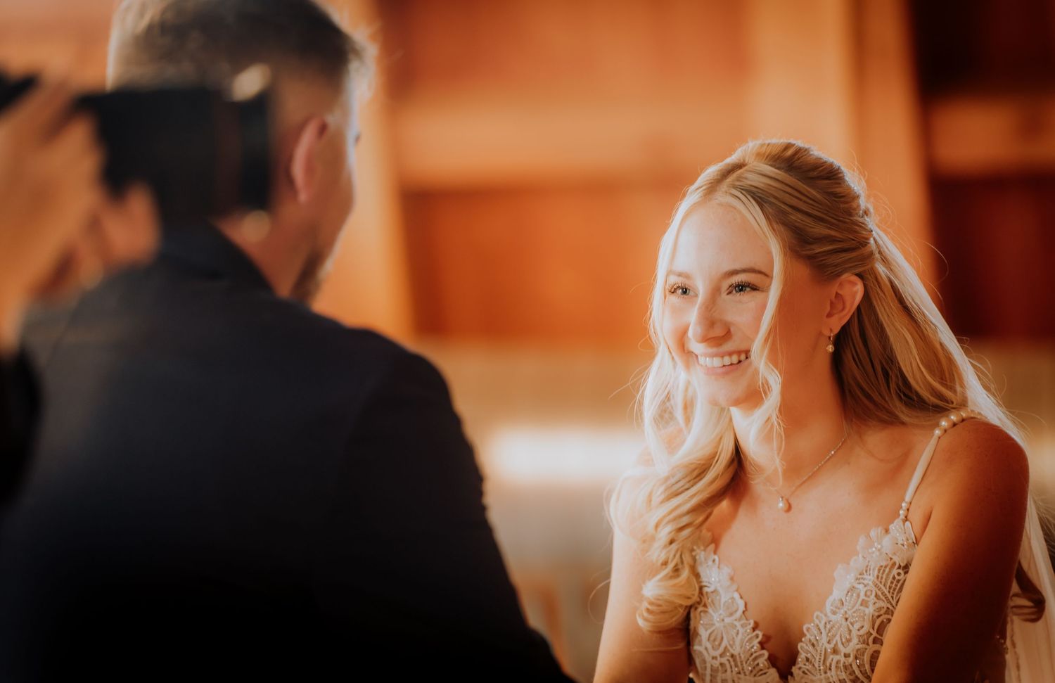 Candid reception moments captured in warm amber lighting.Editorial and Cinematic Wedding photos