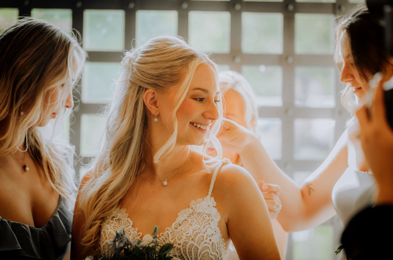 Joyful candid moment during wedding day preparations in natural light.Editorial and Cinematic Wedding photos