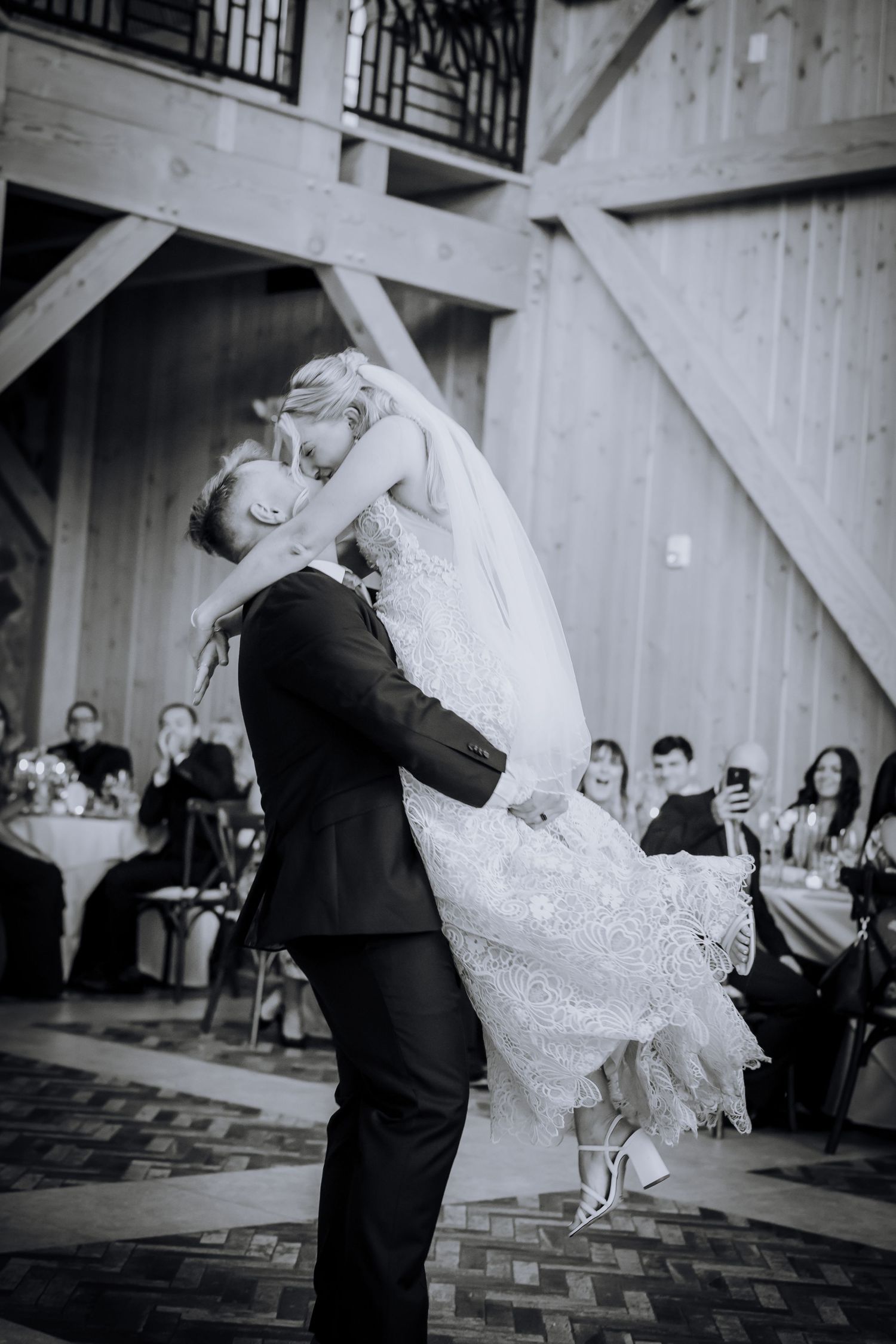 A romantic black and white dance photo of a couple at their wedding reception.Editorial and Cinematic Wedding photos