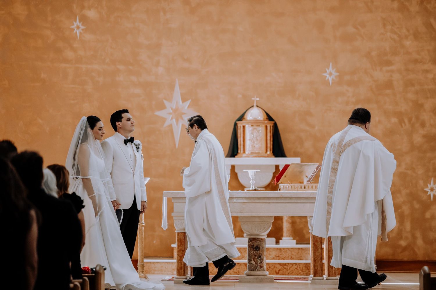 A sequence of wedding ceremony photos showing white-robed figures at an altar in a church setting.Editorial and Cinematic Wedding photos